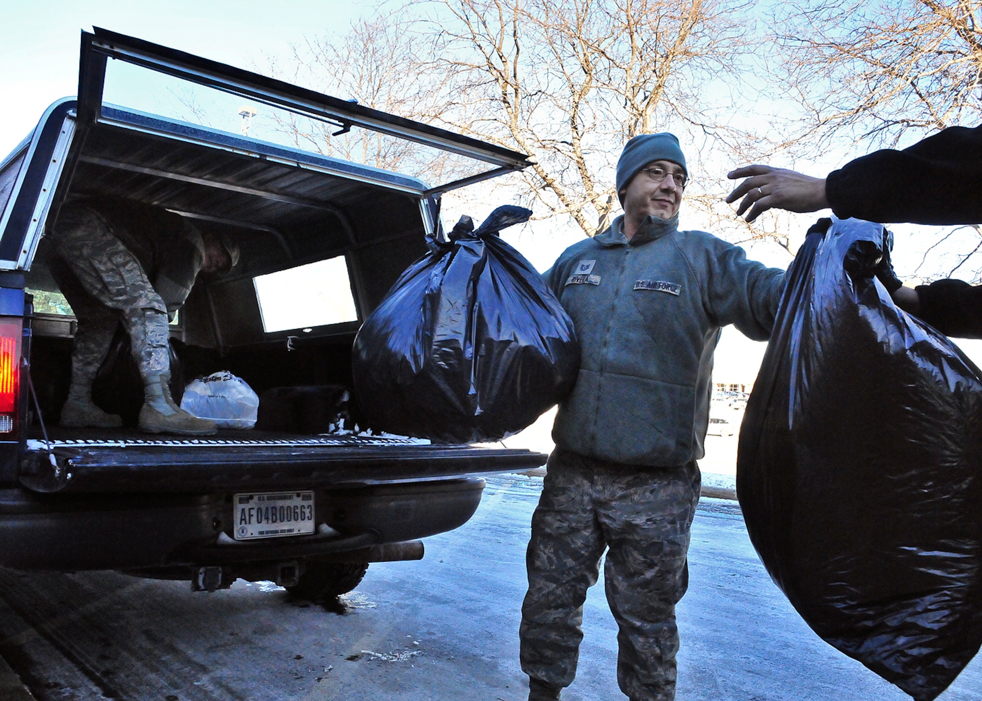 Tech. Sgt. Urbano Rivera (center) relays bags of donated winter coats from Biller (left) to Salvation Army Manager Ray Aten  (right) Friday, 10 Dec. 2010.

Biller and Fox 6 Milwaukee Meteorologist Vince Condella together donated nearly 300 winter coats to the Milwaukee-area Salvation Army.
