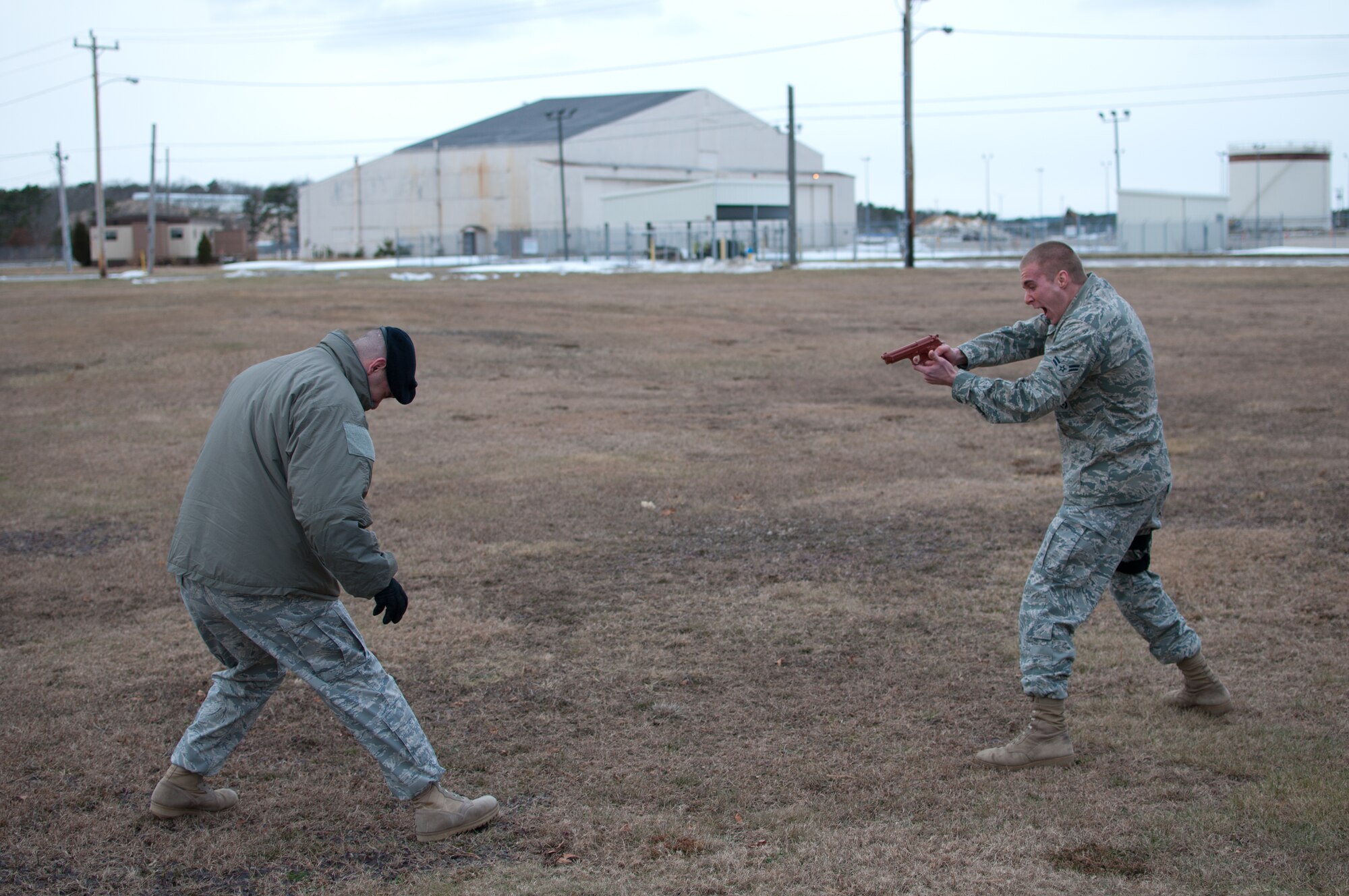 Airman 1st Class Weise of the 102nd Security Forces Suadron tries to fend off an aggressor after being sprayed with Cap-Stun pepper-spray as part of a security forces training event held on Otis Air National Guard Base, Mass. on January 9, 2011. Security Forces airmen were sprayed with the pepper-spray so they are familiar with it's affects and can still perform their duties if they come in contact with it. 