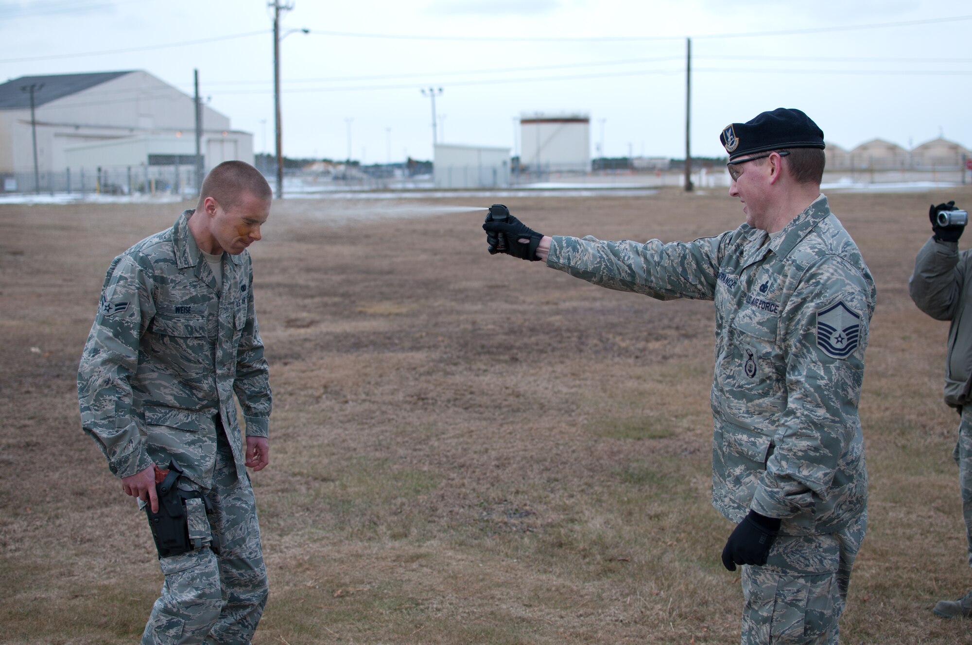Airman 1st Class Weise of the 102nd Security Forces Suadron is sprayed with Cap-Stun pepper-spray by Master Sgt. Christopher Lafrance as part of a security forces training event held on Otis Air National Guard Base, Mass. on January 9, 2011. Security Forces airmen were sprayed with the pepper-spray so they are familiar with it's affects and can still perform their duties if they come in contact with it. 