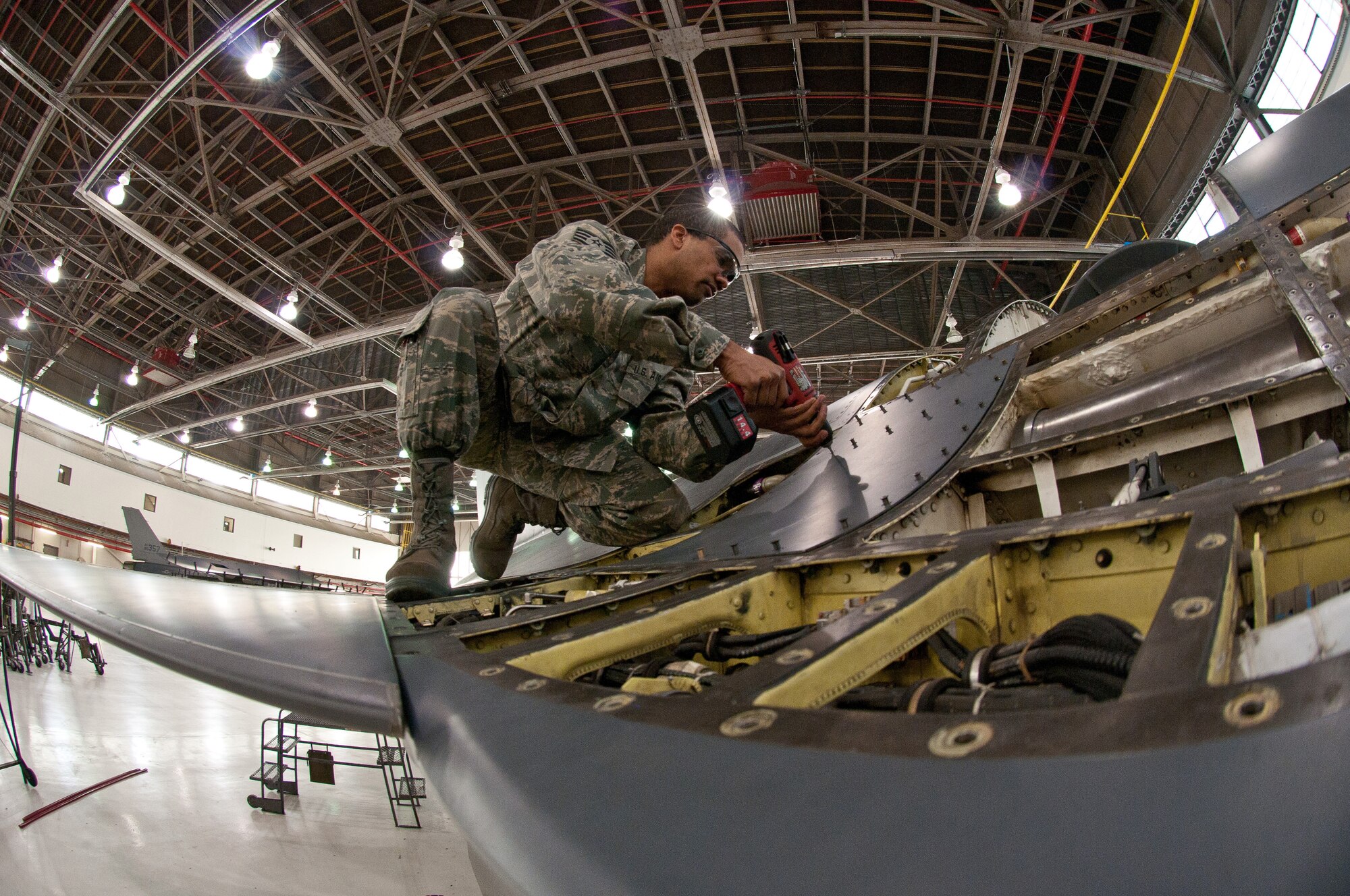 Staff. Sgt Ebon Mitchell, 113th Wing maintenance group, District of Columbia Air National Guard, attaches F-16 body panels that is currently in its 300 hour phase inspection Jan. 8, 2011 at Joint Base Andrews, Md. (U.S. Air Force photo by Master Sgt. Dennis Young)