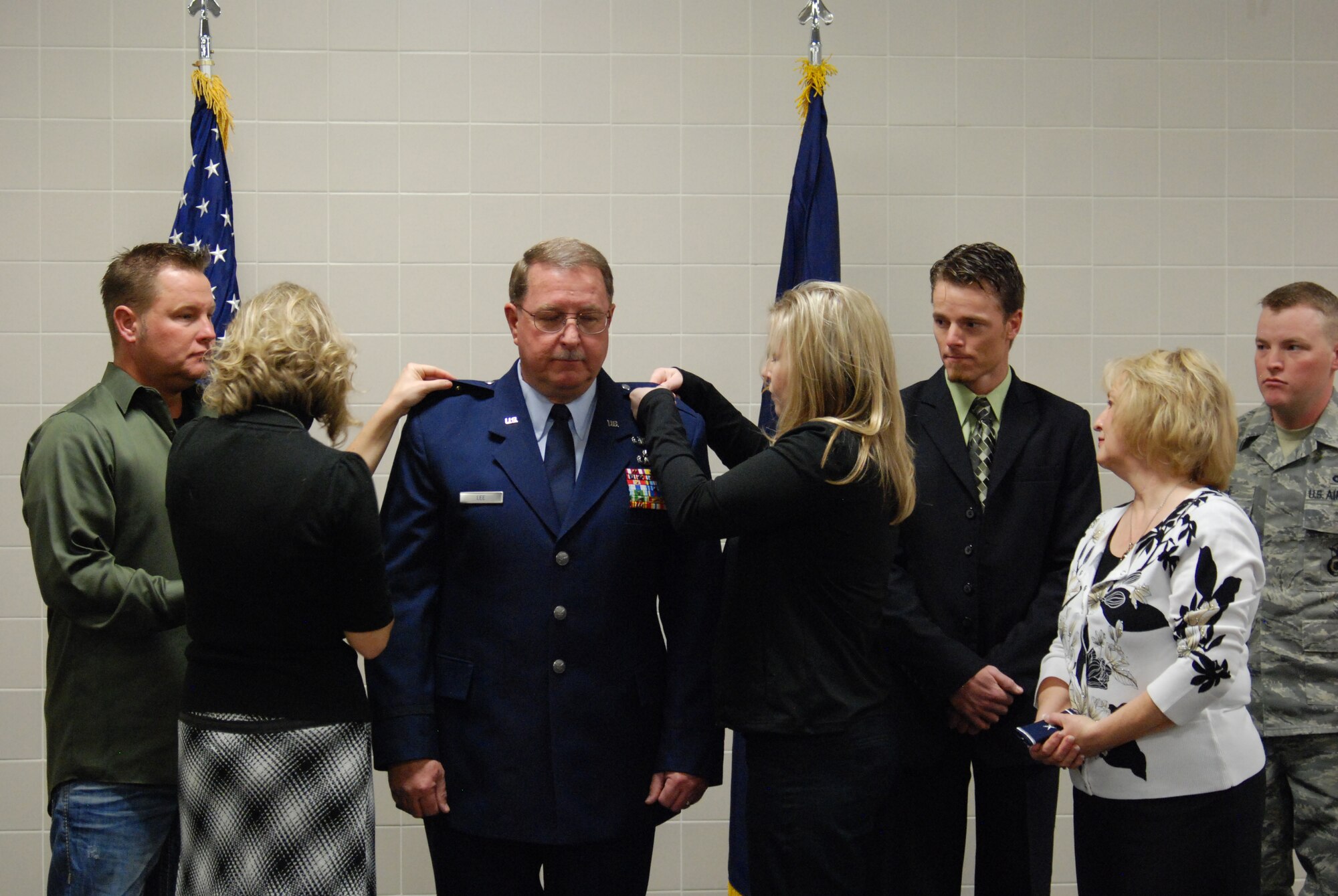 Brig. Gen. Wayne E. Lee, the Utah Assistant Adjutant General for Air, is pinned on by family members Joshua Lee, Rachel Hufstetter, Heather VanWagenen, Jade Lee, Tweet Lee and Tech. Sgt. Chester Lee during a promotion ceremony Jan. 8, 2011, at the Utah Air National Guard Base dining facility. In his comments following the pinning, General Lee mentioned he was humbled by the incredible faith and confidence bestowed upon him. He vowed the Utah ANG will continue to honorably meet its missions in the future. (USAF Photo by Capt. Wayne L. Lee)(Released).