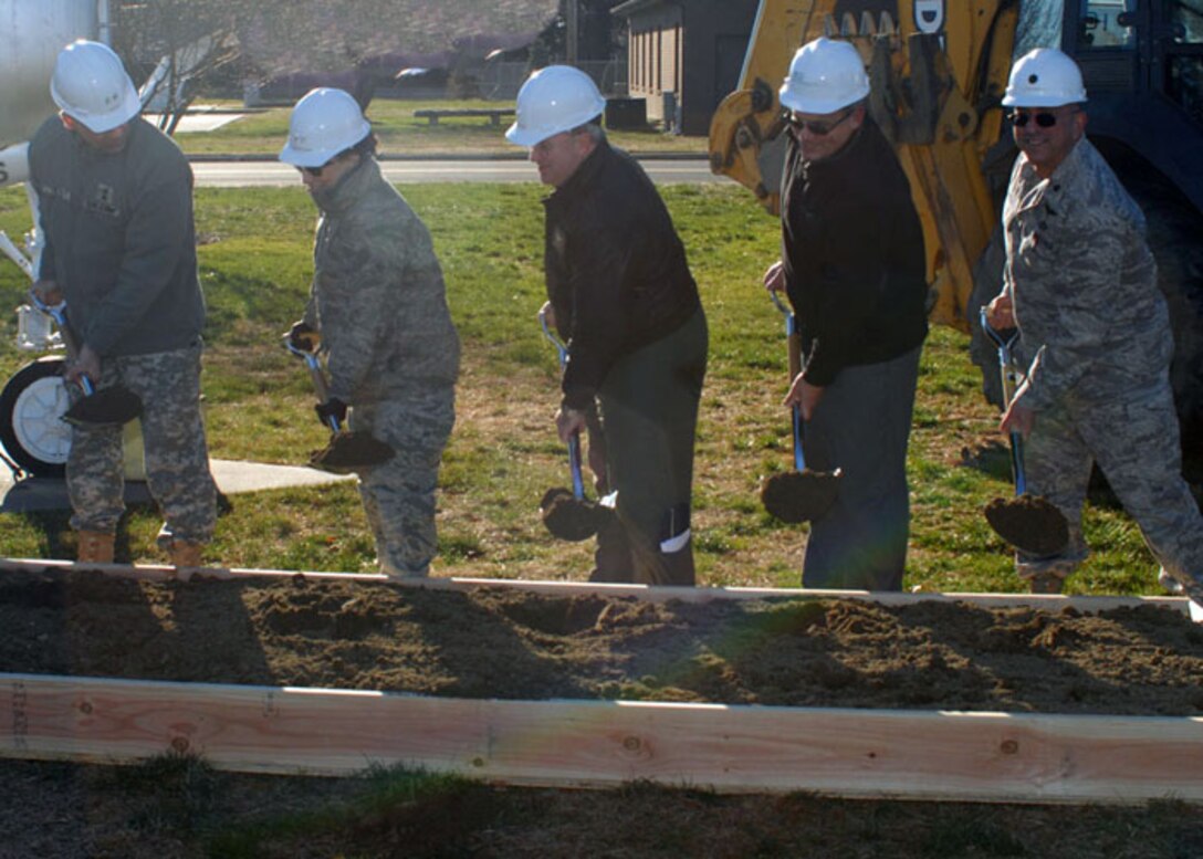 Maj. Gen. Glenn K. Rieth, the Adjutant General, far left; Maj. Gen. Maria Falca-Dodson, Commander of the New Jersey Air National Guard; Brig. Gen. Michael L. Cunniff, Commander of the 108th Wing; an official from Puente Construction; and Lt. Col Paul E. Novello, Commander of the 108th Wing, break ground for the new CE complex on Dec. 21 here at Joint Base McGuire-Dix-Lakehurst, N.J.  (U.S. Air Force photo by Senior Master Sgt. Raymond Knox, 108th Wing Public Affairs Office.