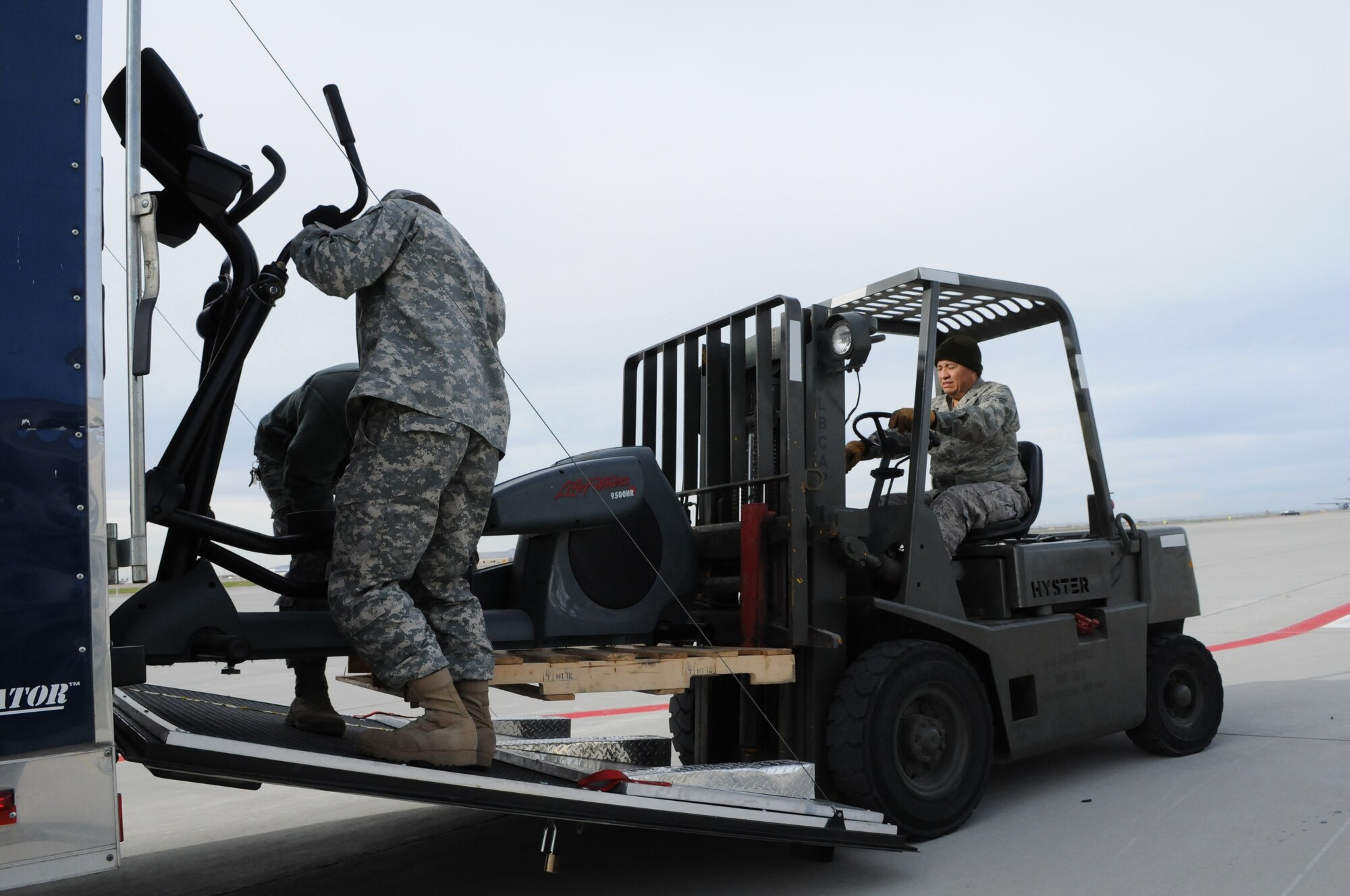 Tech. Sgt. Pascual Ramirez uses a forklift to remove old equipment from the 151st Air Refueling Wing's base gym in Salt Lake City, on Nov. 17, 2010. The base recently purchased $112,000 worth of new equipment to replace older eqipment, enhancing the ability of Airmen to maintain top physical conditioning.(U.S. Air Force photo by Master Sgt. Gary J. Rihn)(RELEASED)