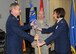 Col Kathleen Hancox receives the Mission Support Group guidon from Col Greg Champagne, 131st Bomb Wing Commander, during the change of command ceremony at Lambert ANGB, Jan 8.  Hancox assumes command from Lt Col. Tim Jones, who becomes the Director of Staff at Missouri State Headquarters, Jefferson City.  (Photo by Master Sgt. Mary-Dale Amison)