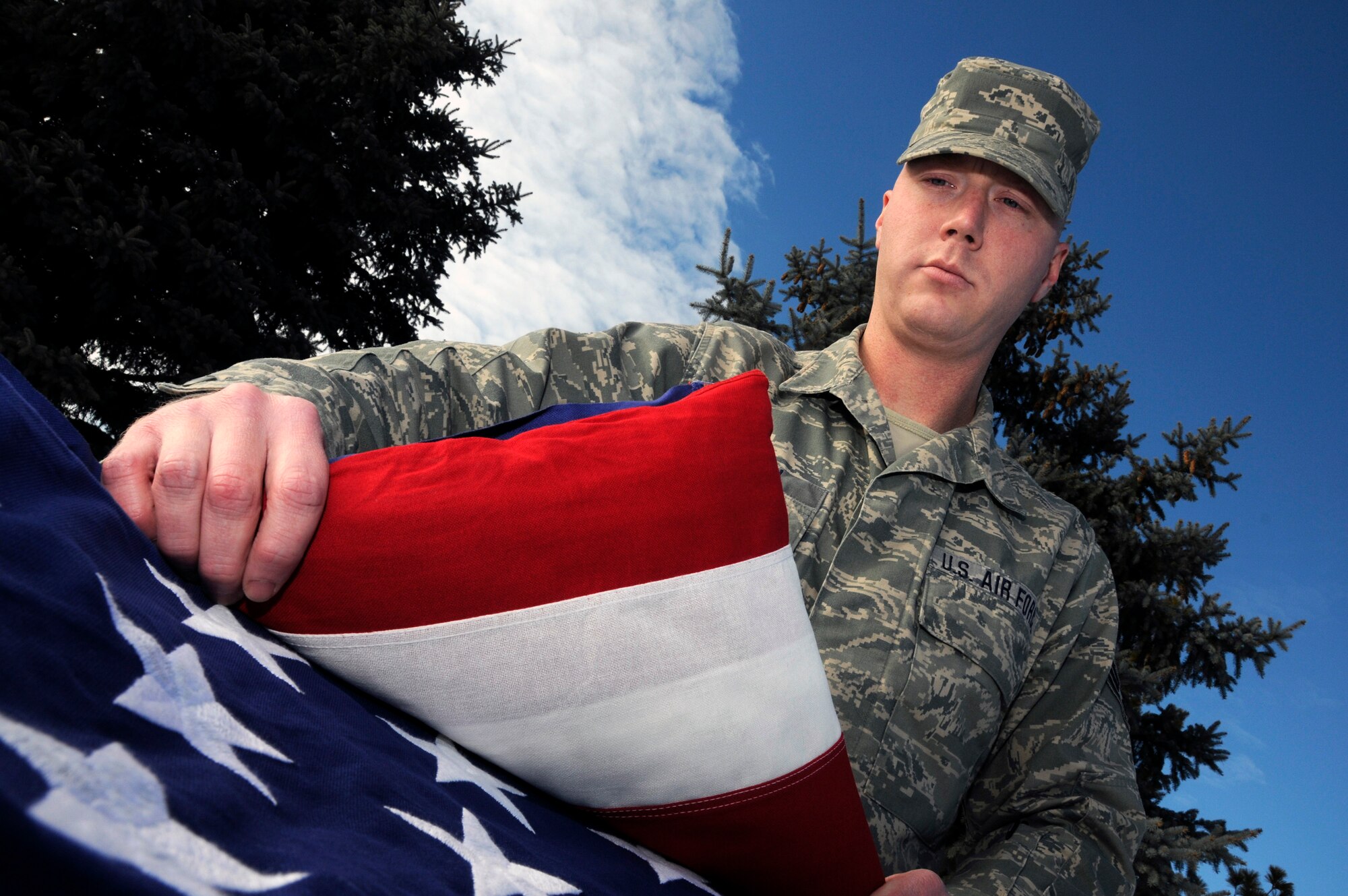 Senior Airman Preston Crandell practices folding an American Flag at the 185th Air Refueling Base in Sioux City, Iowa,  on January 8, 2011. Senior Airman Preston Crandell was awarded the National Guard Honor Guard member of the year for the state of Iowa.
USAF Photo By: Tech. Sgt. Oscar M. Sanchez 