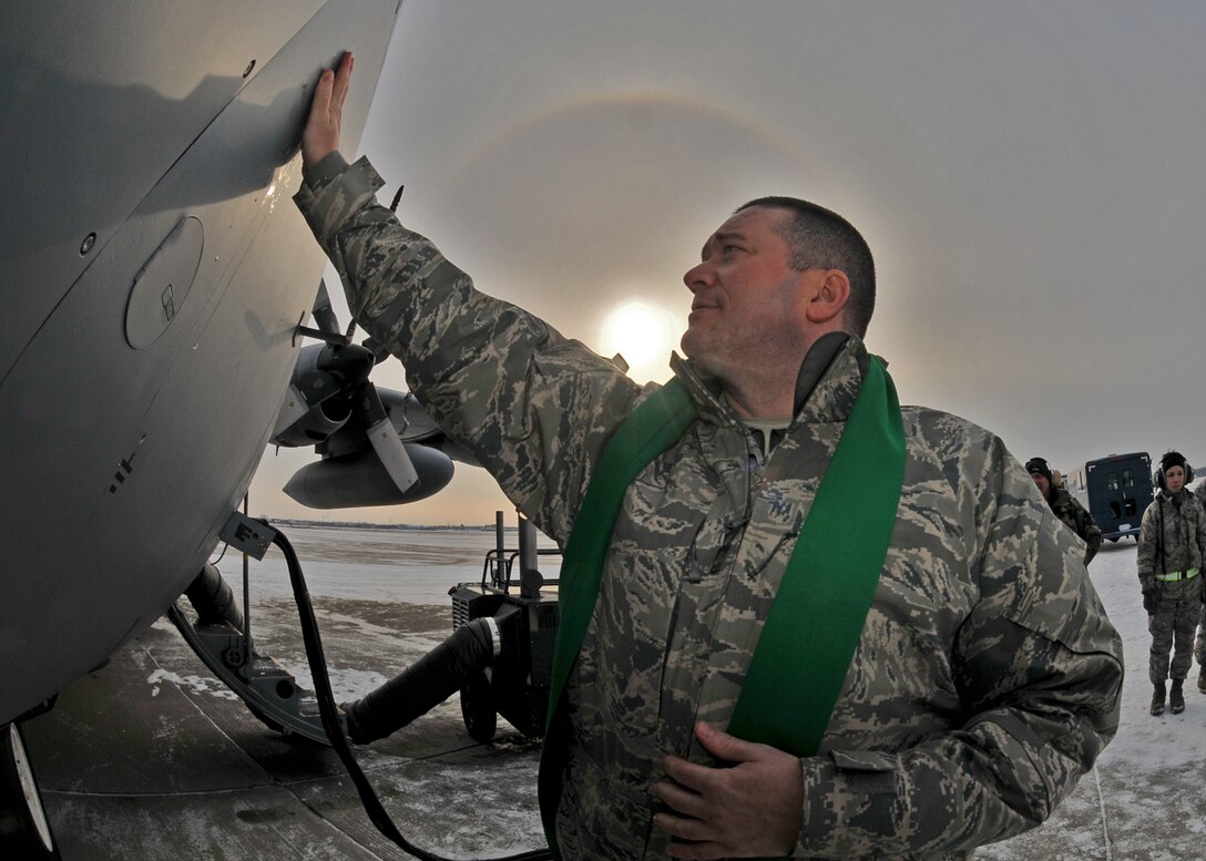 914th Airlift Wing Chaplain (Capt.) James Bastian blesses aircraft on the flightline January 8, 2011 Niagara Falls Air Reserve Station, Niagara Falls, NY. Chaplain Bastion blesses the aircraft and crew before they begin their mission delivering supplies to an undisclosed location in south west Asia. (U.S. Air Force photo by Staff Sgt. Joseph McKee)