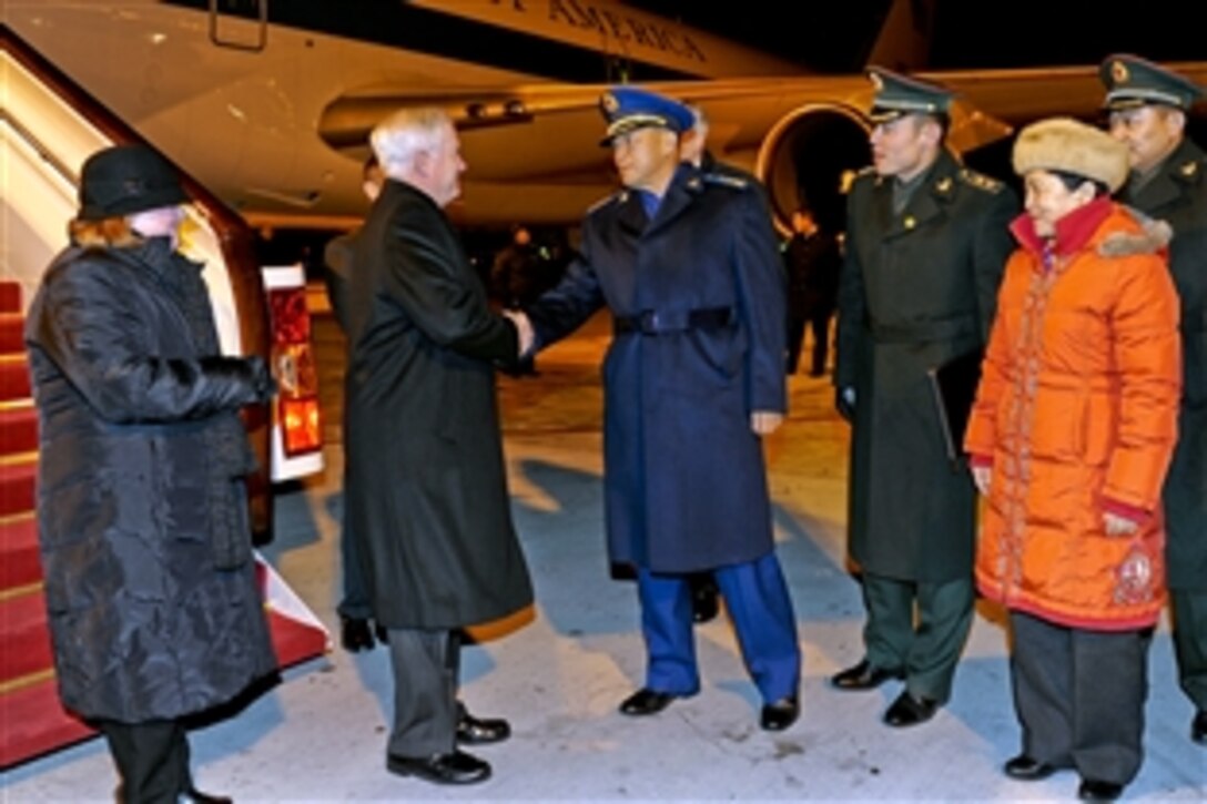 Chinese Gen. Ma Xiaotian, deputy chief of the People's Liberation Army General Staff, welcomes U.S. Defense Secretary Robert M.Gates and his wife, Becky, to Beijing by , at Beijing International Airport, Jan. 9, 2011. Gates arrived in China for a four-day visit in which he will meet with senior military leaders.