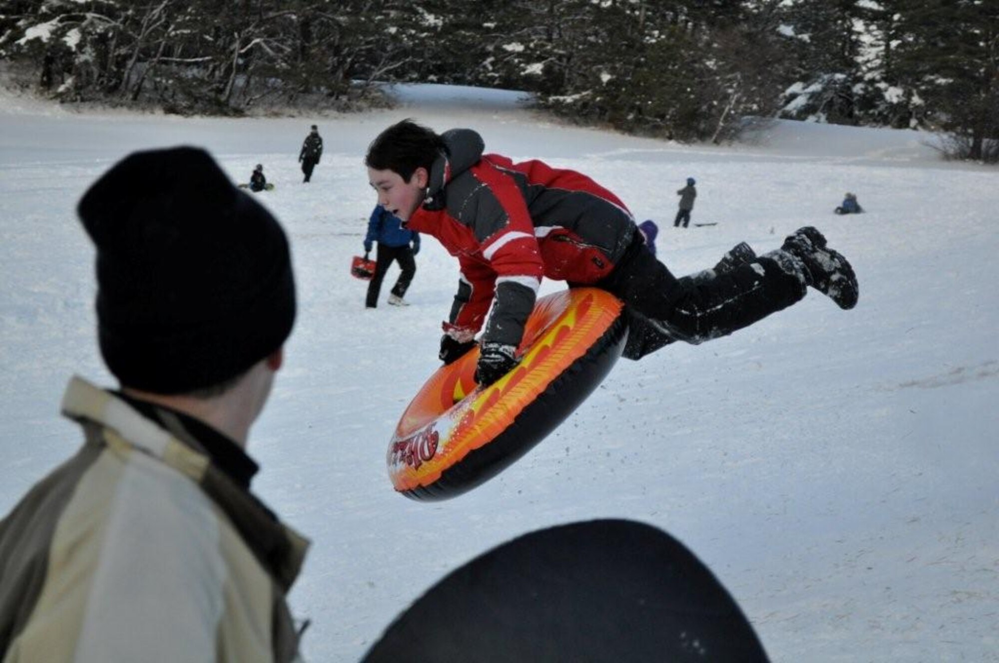 Children enjoy a day of sledding and snowboarding at the Ski Lodge at Misawa Air Base, Japan Jan. 11, 2011. Misawa has received more than 36 inches of snow in the last week, offering lots of opportunities for winter activities. (U.S. Air Force photo by Col Al Wimmer.)