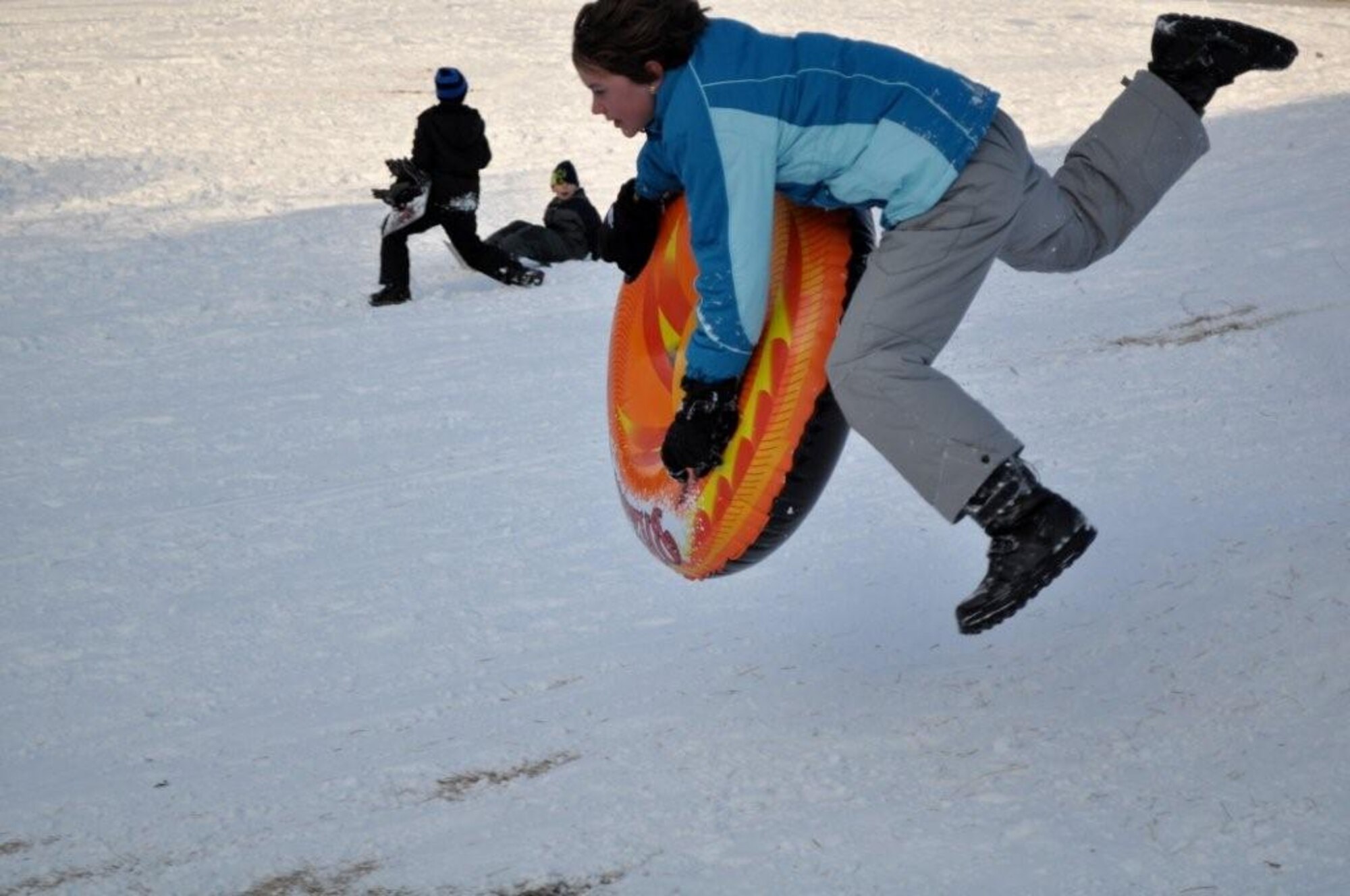 Children enjoy a day of sledding and snowboarding at the Ski Lodge at Misawa Air Base, Japan Jan. 11, 2011. Misawa has received more than 36 inches of snow in the last week, offering lots of opportunities for winter activities. (U.S. Air Force photo by Col Al Wimmer.)