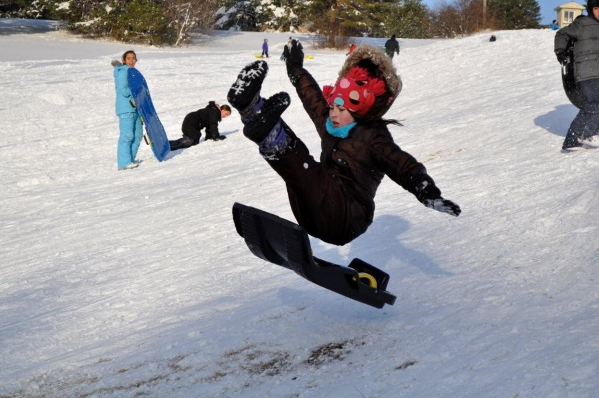 Children enjoy a day of sledding and snowboarding at the Ski Lodge at Misawa Air Base, Japan Jan. 11, 2011. Misawa has received more than 36 inches of snow in the last week, offering lots of opportunities for winter activities. (U.S. Air Force photo by Col Al Wimmer.)