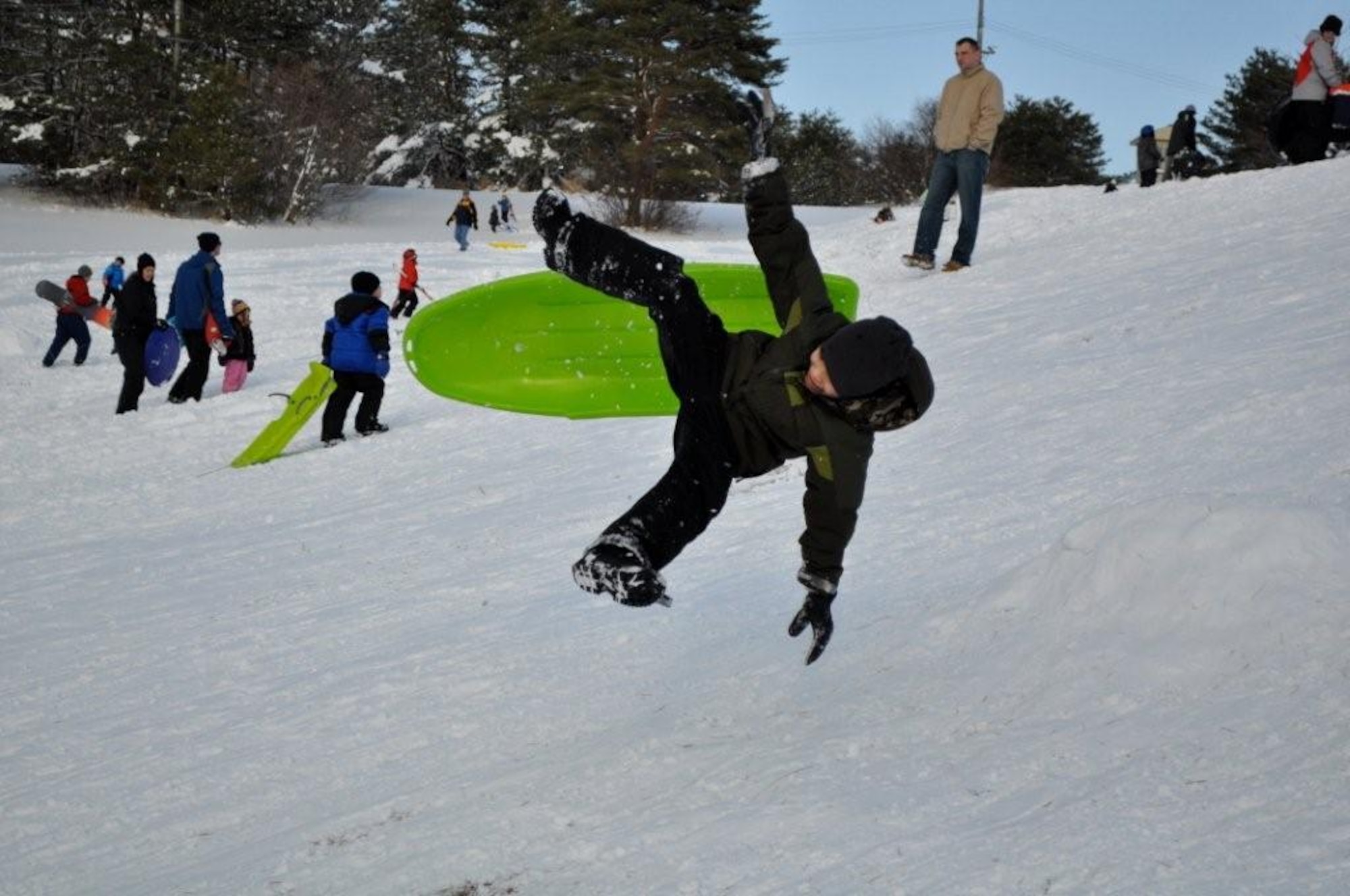 Children enjoy a day of sledding and snowboarding at the Ski Lodge at Misawa Air Base, Japan Jan. 11, 2011. Misawa has received more than 36 inches of snow in the last week, offering lots of opportunities for winter activities. (U.S. Air Force photo by Col Al Wimmer.)
