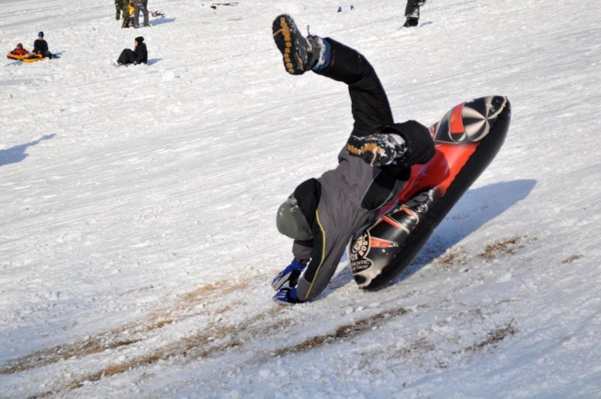 Children enjoy a day of sledding and snowboarding at the Ski Lodge at Misawa Air Base, Japan Jan. 11, 2011. Misawa has received more than 36 inches of snow in the last week, offering lots of opportunities for winter activities. (U.S. Air Force photo by Col Al Wimmer.)