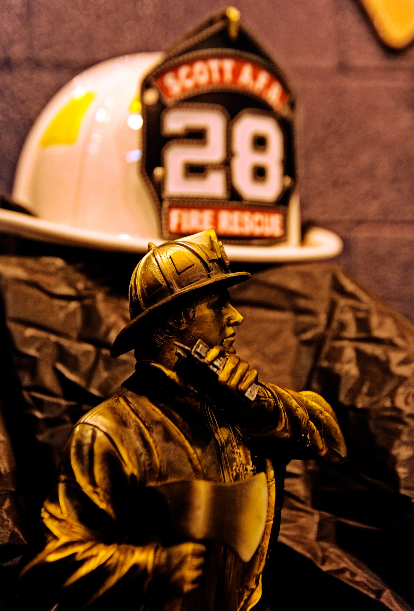 A display at a final alarm ceremony held Jan. 10, 2010, shows various trinkets in remembrance of Rick Grammer, Air Mobility Command fire chief, during a Final Alarm Ceremony at Scott Air Force Base, Ill.  Mr. Grammer passed away last week. A Final Alarm Ceremony is a traditional final tribute to a firefighter who has passed.  The ceremony begins by calling the passed firefighter’s name and is followed by the ringing of the ceremonial fire bell.  Bagpipes are also commonly played.  The ceremony represents the firefighter’s final call to duty. (U.S. Air Force photo/ Staff Sgt. Ryan Crane)