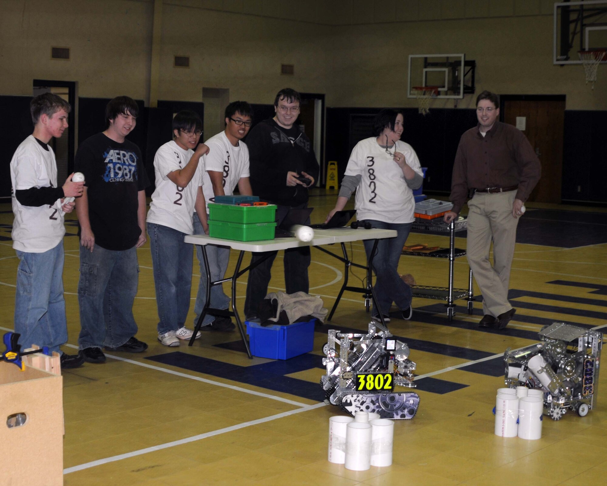 ALTUS AIR FORCE BASE, Okla. – The Longshots, Southwest Technology Center’s robotics team, shoots a plastic ball into a wooden box from one of the robots during a robotics demonstration for the kids at the Youth Center here. The Longshots have qualified for the World Competition in 2009 and 2010. (U.S.  Air Force photo by Airman 1st Class Kenneth W. Norman)