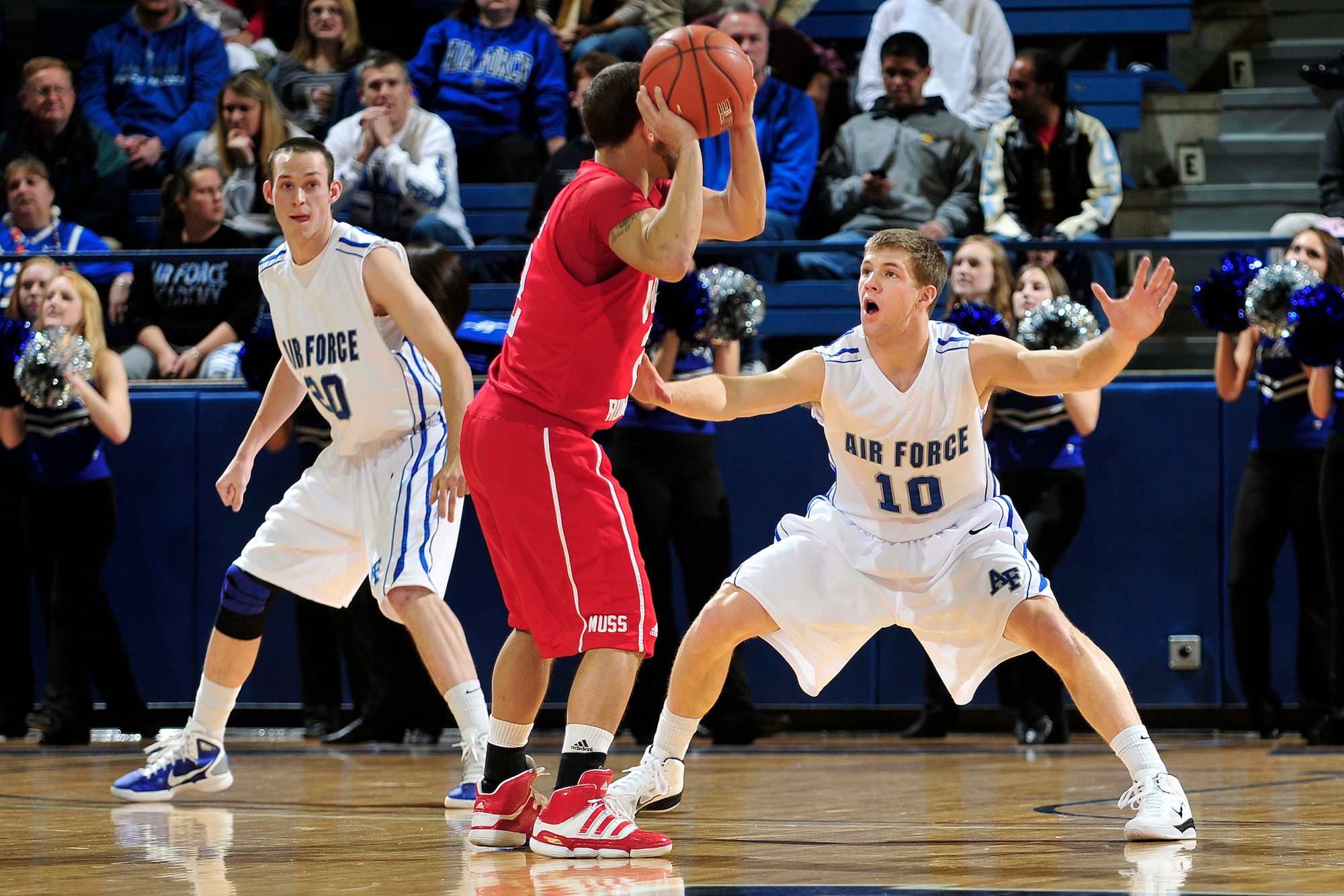 Air Force Academy sophomore Todd Fletcher plays tight defense on Utah's Chris Kupets during the Falcons Mountain West Conference home opener Jan. 5, 2011, at the Academy's Clune Arena in Colorado Springs, Colo. The Falcons upset the Utes 77-69. (Air Force photo/Bill Evans)