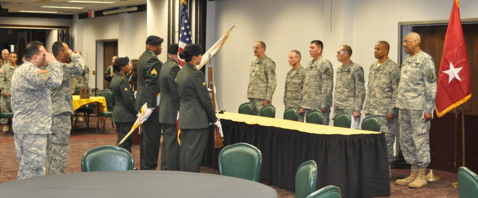 The Soldiers of the 7230th Medical Support Unit and honored guests observe the presentation of the colors at a deployment ceremony at the Hap Arnold Club Jan. 5, 2011, at March Air Reserve Base, Calif.  The southern California Army reservists, who are based at the Armed Forces Reserve Center adjacent to the base, will deploy for a year to support medical screenings for the Soldier Readiness Program at Joint Base Lewis-McChord, Wash.    (U.S. Air Force photo/Megan Just)