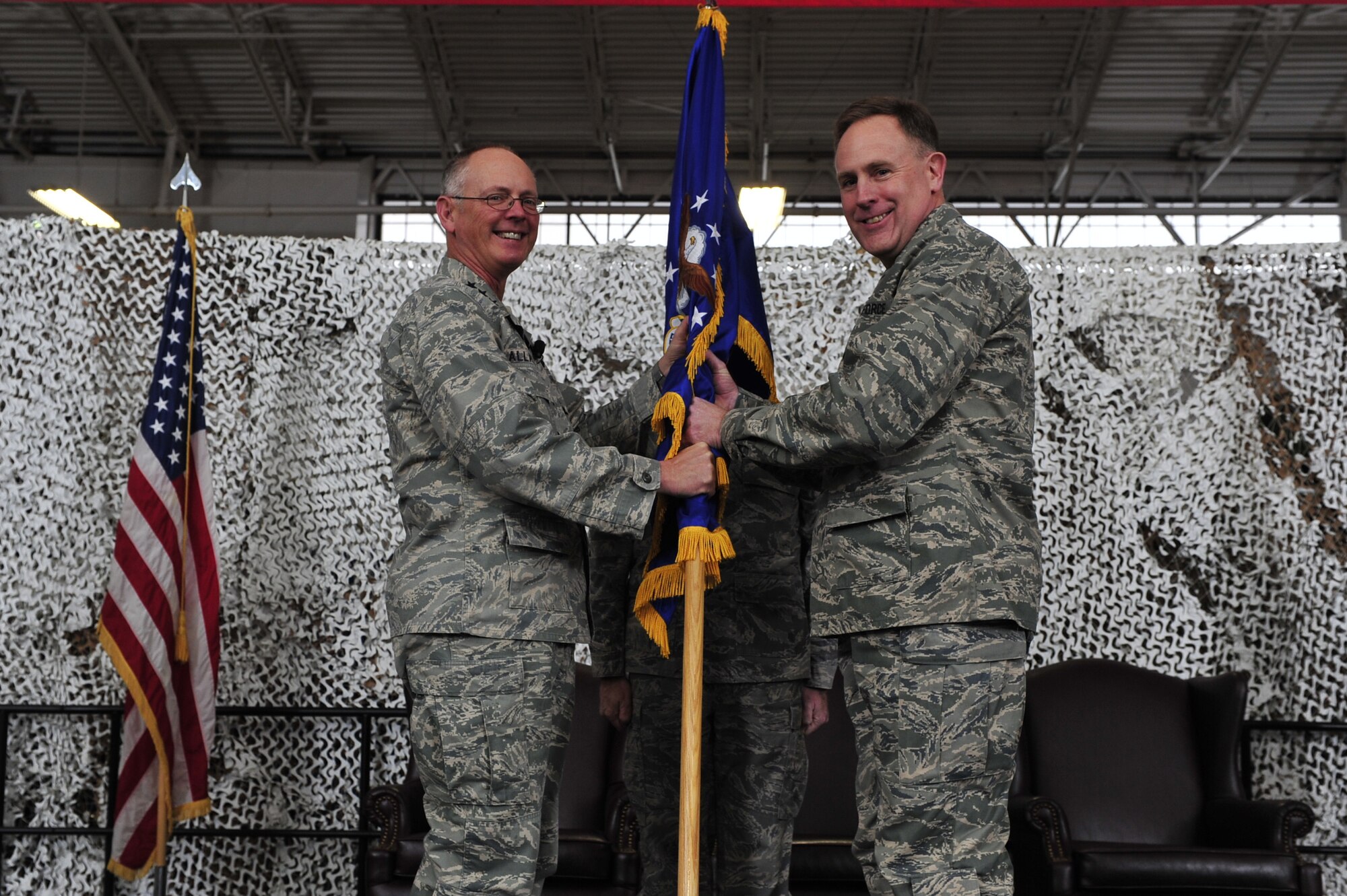 JOINT BASE MCGUIRE-DIX-LAKEHURST, N.J. -- Brig. Gen. Scott Goodwin receives command of the 21st Expeditionary Mobility Task Force from Lt. Gen. Robert R. Allardice, commander, 18st Air Force, in a ceremony at the 621st Contingency Response Wing’s Global Reach Deployment Center here Jan. 7. General Goodwin took command from Brig. Gen Michael Kim, who will be returning to his duties as the mobilization assistant to the director of operations at Air Mobility Command headquarters, Scott Air Force Base, Ill. (U.S. Air Force photo / Tech. Sgt. Parker Gyokeres)(released)