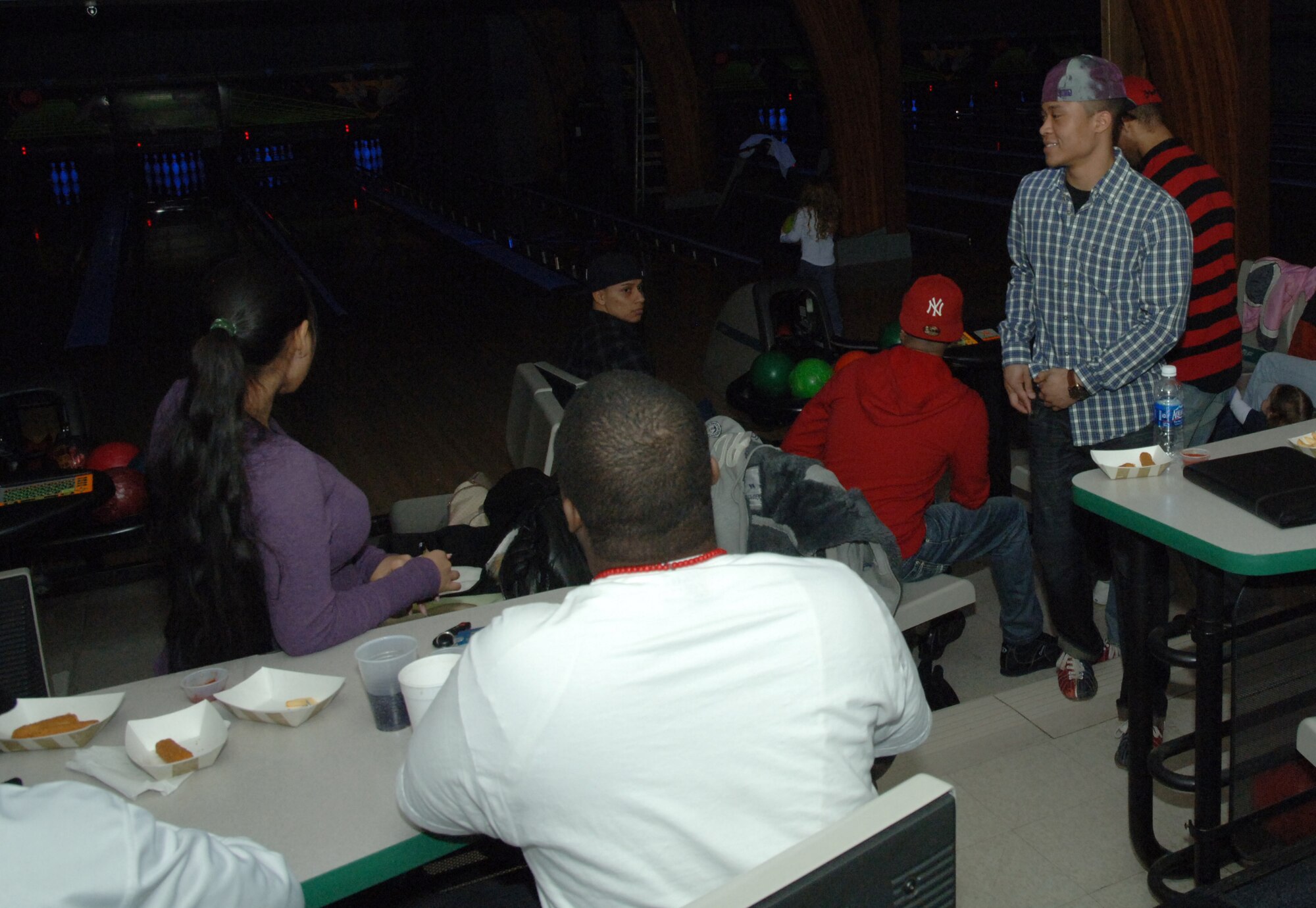Airmen and their families from Grand Forks Air Force Base enjoy a night of free cosmic bowling Jan. 8 at Dakota Lanes. The event was hosted by the Air Force Sergeant Association and the Top 3 as an Airmen appreciation event that also included free appetizers and raffle prizes. (U.S. Air Force photo by Airman Derek VanHorn)