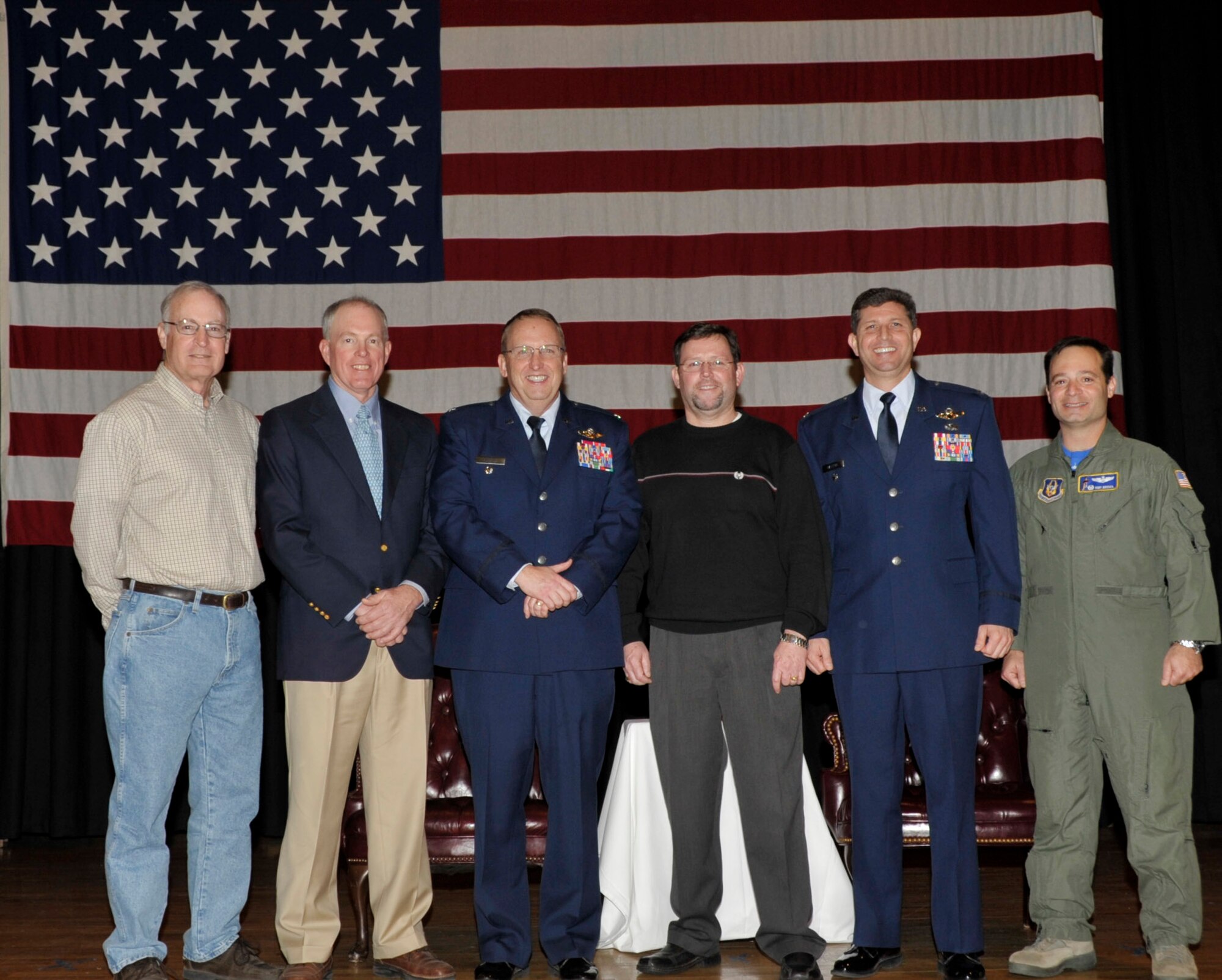 Former 18th Air Refueling Squadron commanders, retired Lt. Col. Ellis Yoder, retired Col. Ron Johnston, retired Col. Clayton Childs, retired Col. Randy Foster, Col. Ted Matthews, who now serves as the Vice Commander 927th Air Refueling Wing and current 18th ARS Commander, Lt. Col. Tony Brusca pose for a photo following the retirement of Colonel Childs. Colonel Childs, a Kansas native, served at McConnell Air Force Base for 10 years.