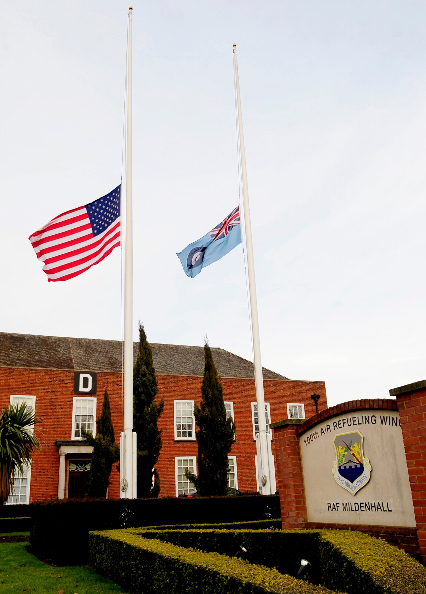 RAF MILDENHALL, England -- Flags are at half-staff Jan. 10, 2011, in honor of the victims shot in Tucson, Ariz., Jan. 8, 2011.  Rep. Gabrielle Giffords, D-Ariz., was among the victims and is in critical condition at University Medical Center. The dead are identified as U.S. District Judge John Roll, chief federal judge of Arizona; Dorothy Murray, Dorwin Stoddard, Phyllis Schneck; Gabriel Zimmerman and 9-year-old Christina Greene. At the direction of the President of the United States, the flag of the United States is flying at half-staff until further notice. (U.S. Air Force photo/Senior Airman Ethan Morgan)