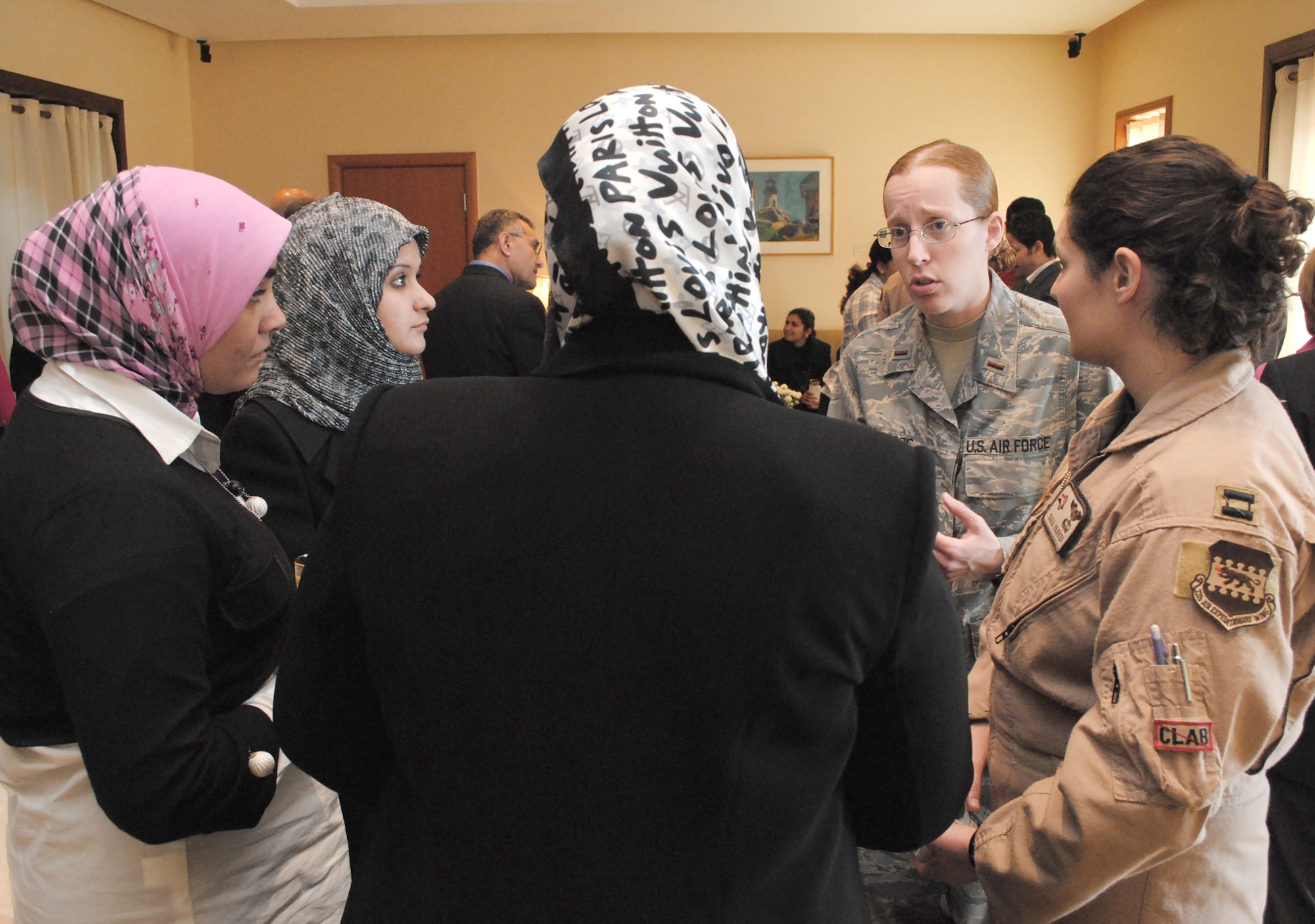 2nd Lt. Lila McClintoc talks to several Iraqi women about her experiences in the aviation career field during a luncheon for the Horizon East Women in Aviation, International chapter at the U.S. Embassy Jan. 7, 2010, in Baghdad. The Women in Aviation, International was established to encourage women to seek opportunities in aviation career fields and interests. Lieutenant McClintoc is a maintenance officer from the 332nd Expeditionary Aircraft Maintenance Squadron.(U.S. Army photo/Spc. Amie J. McMillan)