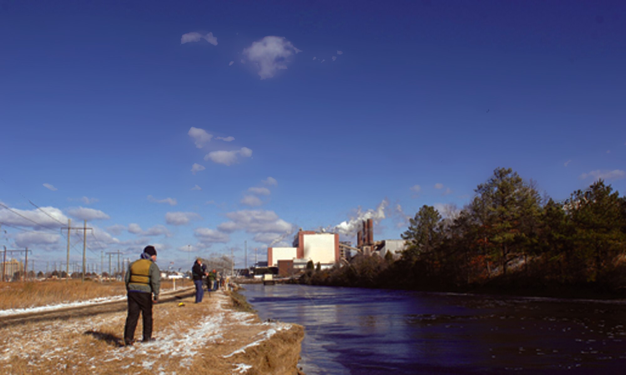 Wounded warriors, veterans and volunteer guides brave frigid temperatures for a chance to catch the Red Drum and Speckled trout fish that make the warm waters of the hot ditch their winter home during a fishing trip Dec. 14.