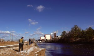 Wounded warriors, veterans and volunteer guides brave frigid temperatures for a chance to catch the Red Drum and Speckled trout fish that make the warm waters of the hot ditch their winter home during a fishing trip Dec. 14.