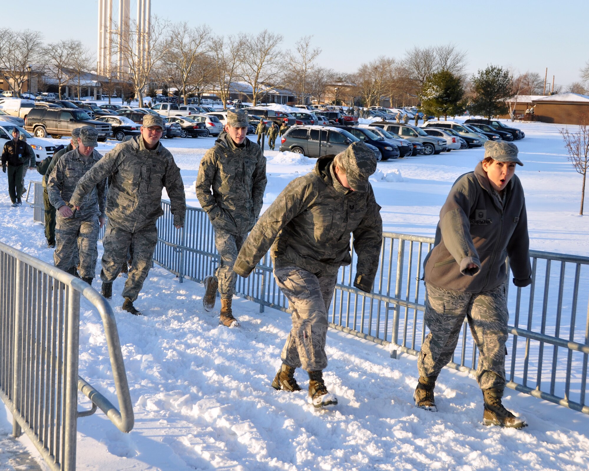 JOINT BASE MCGUIRE-DIX-LAKEHURST, N.J. ? Airmen of the 514th Air Mobility Wing brave the snow and cold, windy weather while walking toward the McGuire Theater on their way to a wing commander?s call here Jan. 9, 2011. (U.S. Air Force photo/Tech. Sgt. Shawn J. Jones)