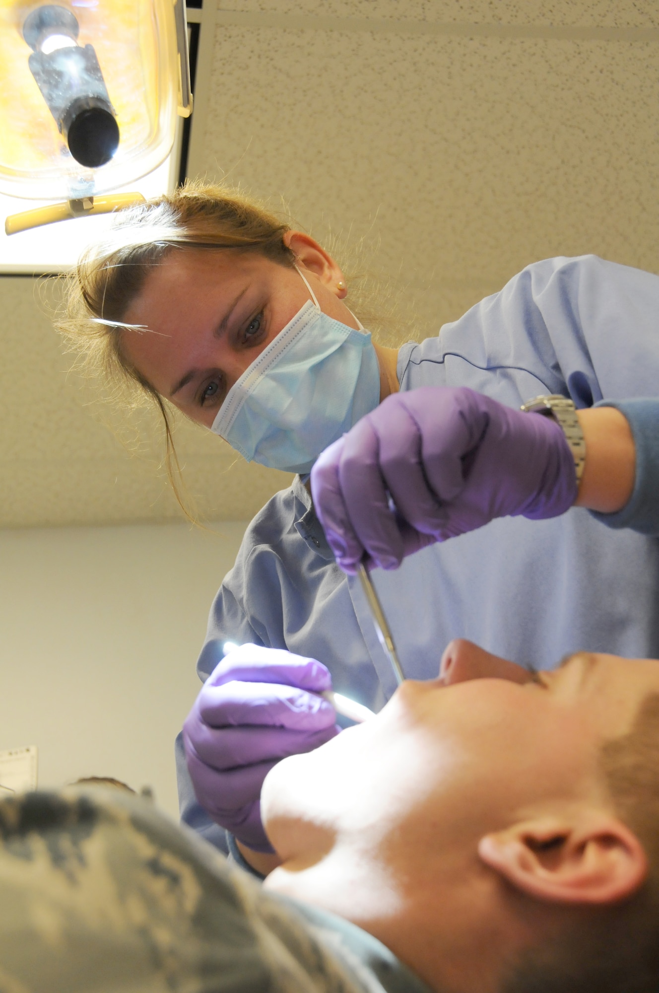 Ohio Air National Guard, Maj. Jennifer
Ludwig a dentist from the 180th Fighter
Wing Medical Group, examines a patient
for their annual dental check-ups January
8, 2011. Members from the 180th
Medical Group are preparing for a health
services inspection in April 2011.