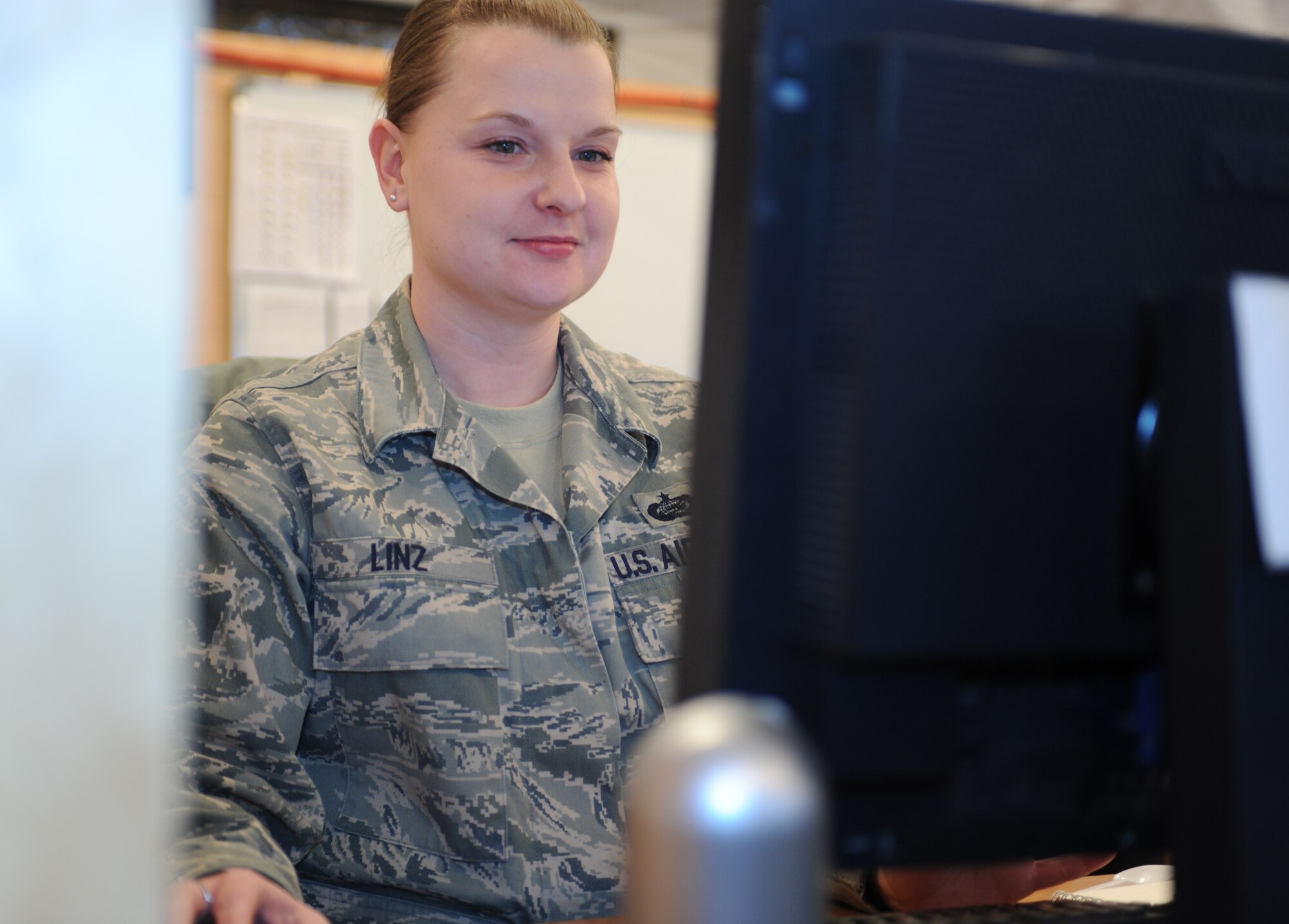 Staff Sgt. Christina Linz, Transit Center at Manas Joint Movement Control Center member, updates the personnel database system.  Sergeant Linz, a deployed personnelist from Elmendorf Air Force Base, Alaska is serving in a joint expeditionary tasking, or JET, and assigned to the Army.   (U.S. Air Force photo/ Tech. Sgt. Jerome C. Baysmore)