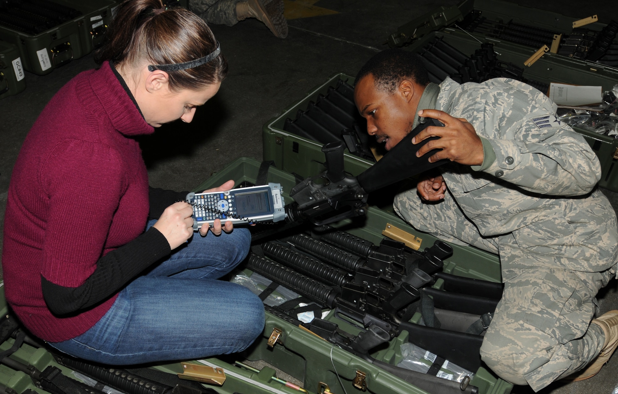 Lorae Gudgel, A2B Company marking technician, and Senior Airman Rashon Forbes, 31st Logistics Readiness Squadron document control technician, scan a barcode on a weapon for inventory Dec. 17 as part of the new, revolutionary asset marking and tracking system being implemented at Air Force installations around the world. Each piece of equipment is being marked with a unique bar code that, when scanned, will provide the serial number and equipment information, including what the piece of equipment is, what base it belongs to and who it has been signed out to. (U.S. Air Force photo by Tech. Sgt. Darrell Dean)