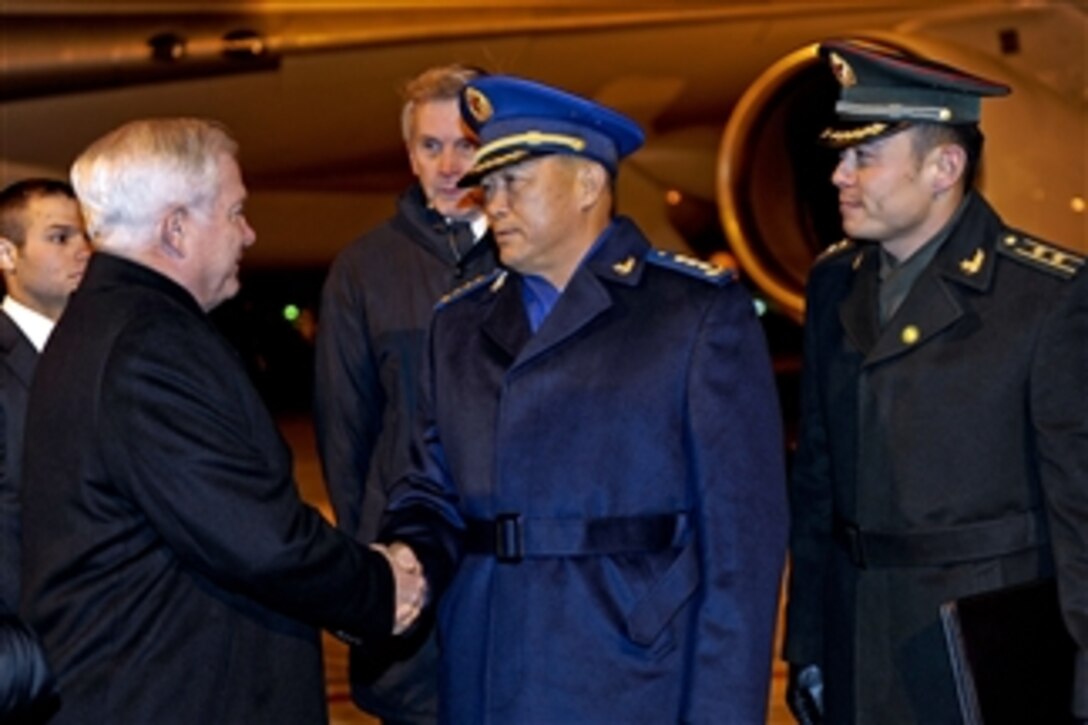 Secretary of Defense Robert M. Gates (left) shakes hands with Deputy Chief of the People's Liberation Army General Staff Gen. Ma Xiaotian at Beijing International Airport on Jan. 9, 2011.  Gates arrived in China for a four-day visit in which he will meet with senior military leaders.  