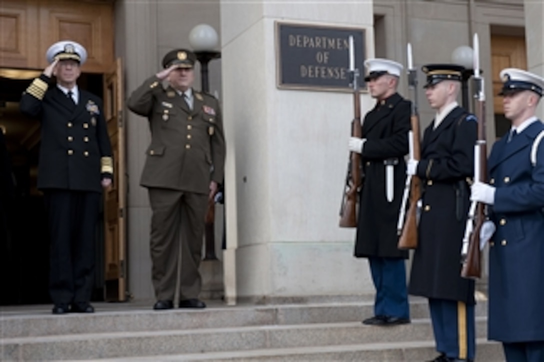 Chairman of the Joint Chiefs of Staff Adm. Mike Mullen, U.S. Navy, and Croatian Chief of Defense Gen. Josip Lucic salute the playing of their national anthems during a ceremony welcoming Lucic to the Pentagon on Jan. 10, 2011.  