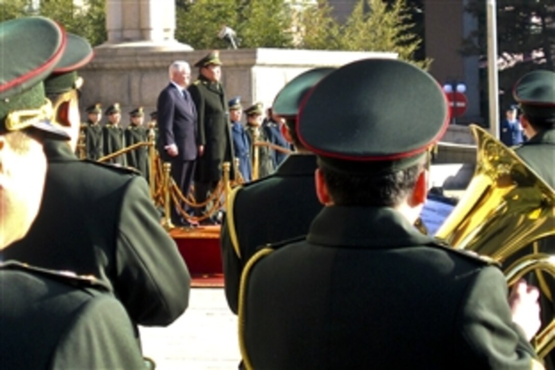 U.S. Defense Secretary Robert M. Gates and Chinese Gen. Liang Guanglie, the National Defense minister, participate in a welcoming ceremonmy for Gates at the Bayo Building in Beijing, Jan. 10, 2011.