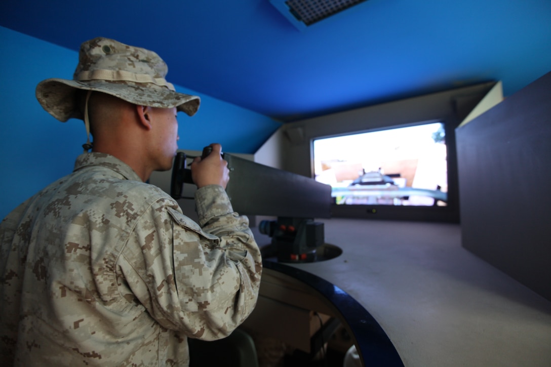 Lance Cpl. Yilson Chong, a machine gunner with Alpha Company, 1st Battalion, 23rd Marine Regiment, assumes the role of a .50 caliber machine gunner during mobile counter-improvised explosive device interactive training at Camp Pendleton, Calif., Jan. 10. Chong has previously deployed to Iraq. This will be his first deployment to Afghanistan. (U.S. Marine Corps photo By Cpl. Lucas Vega)