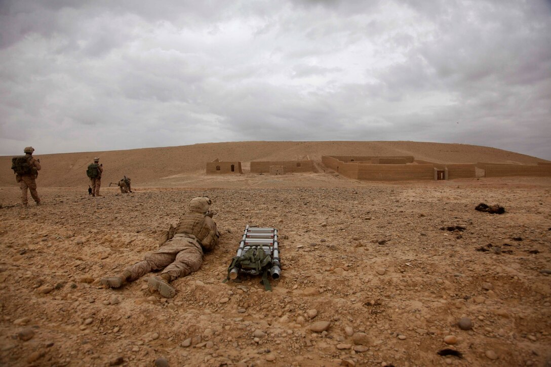 U.S. Marines with Lima Company, 3rd Battalion, 5th Marine Regiment conduct a census patrol in Sangin, Afghanistan, Jan. 10, 2011. The Marines conduct patrols to suppress enemy activity and gain the trust of the people. The battalion, assigned to Regimental Combat Team 2, conducted counterinsurgency operations in partnership with the International Security Assistance Force.