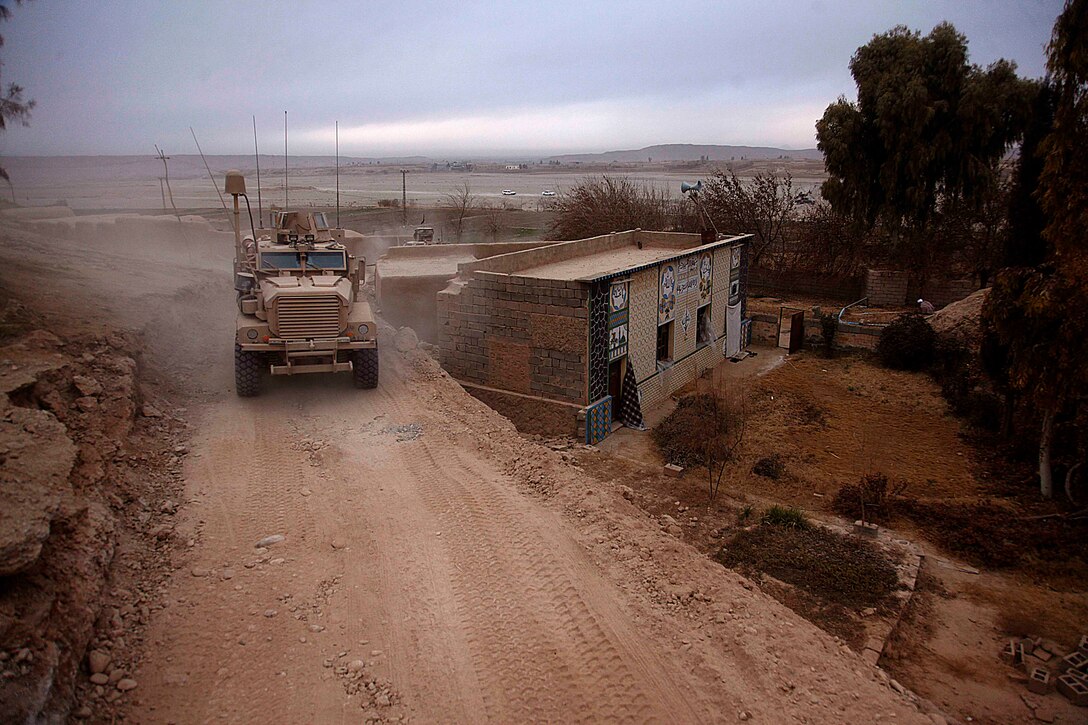 U.S. Marines with Lima Company, 3rd Battalion, 5th Marine Regiment conduct a census patrol in Sangin, Afghanistan, Jan. 10, 2011. The Marines conduct patrols to suppress enemy activity and gain the trust of the people. The battalion, assigned to Regimental Combat Team 2, conducted counterinsurgency operations in partnership with the International Security Assistance Force.