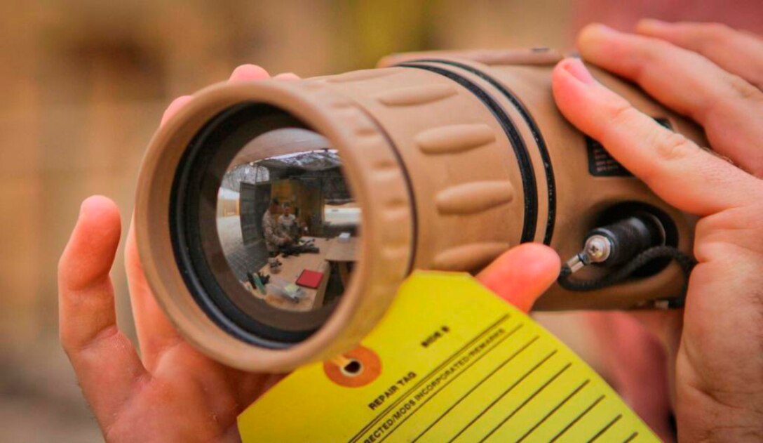 Cpl. Joseph Nordone, 21, electro-optical ordnance repairman, Support Company, Combat Logistics Battalion 3, 1st Marine Logistics Group (Forward), inspects a damaged AN/PAS-28 thermal binocular aboard Camp Dwyer, Afghanistan, Jan. 10. Since October, approximately 15 Marines with CLB-3’s Ordnance Platoon have repaired more than 500 weapon systems and tactical equipment for units operating throughout Helmand province.