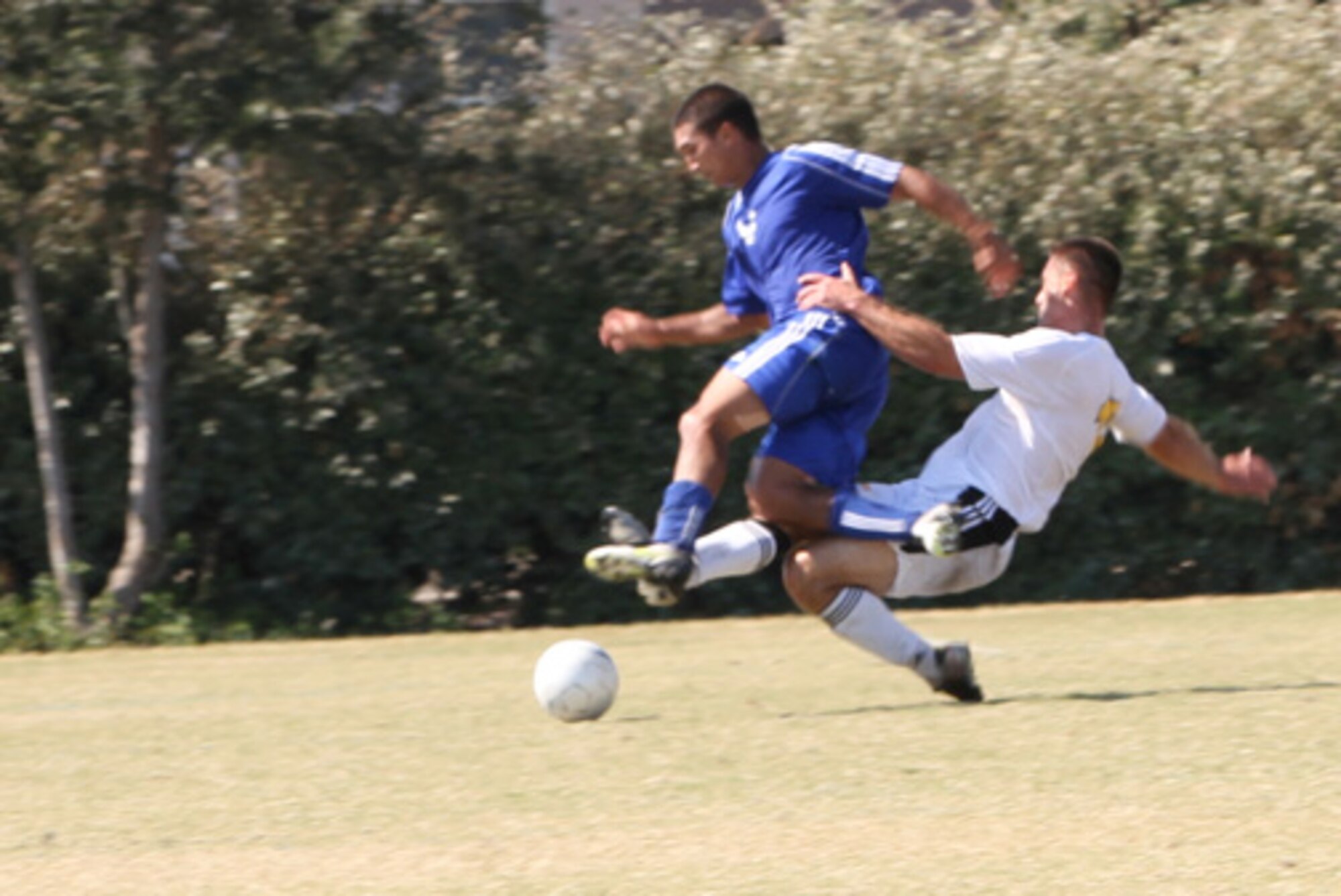 Battling for possession of the ball, Air Force’s Jason Belvill (Number 20) beats an Army defender only to find himself tangled up in a retaliatory foul resulting in a free kick. Air Force went on to win the match 2-1 during the Round Robin tournament at the 2010 Armed Forces Men’s Soccer Championship held in October. (Courtesy photo)