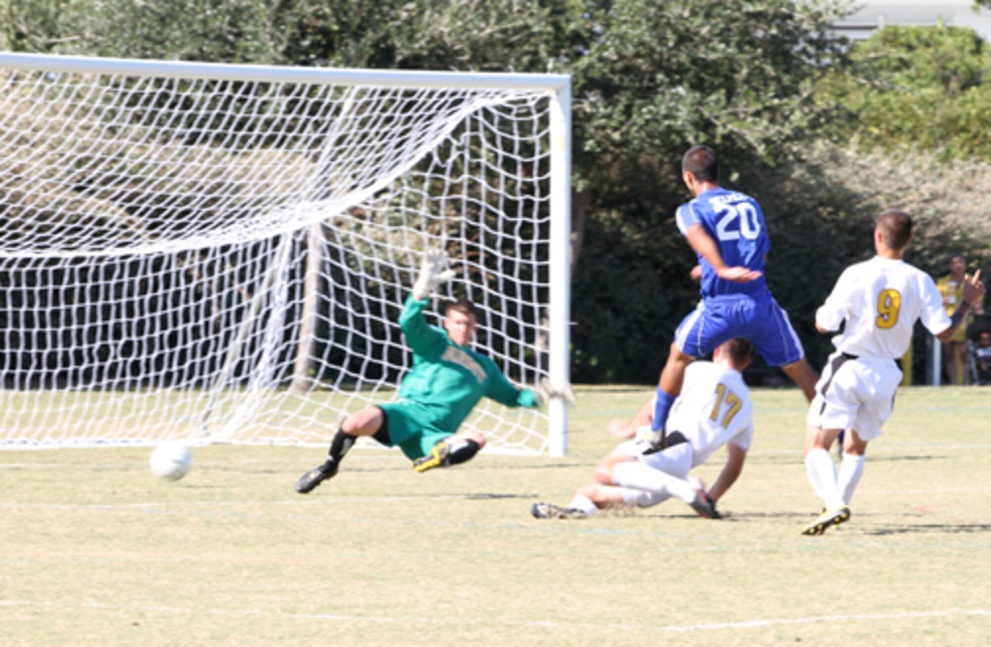 Air Force’s Jason Belville (Number 20) splits two Army defenders while receiving a cross, chests the ball into space and beats the goalkeeper off a left-footed volley. Air Force went on to win the match 2-1 during the Round Robin tournament at the 2010 Armed Forces Men’s Soccer Championship held in October. (Courtesy photo)