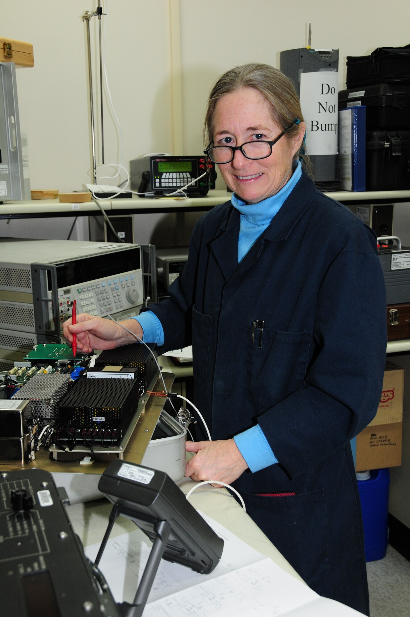 Kathy McConaghie troubleshoots an engine test set while working in the DC/Low Frequency area.  Ms. McConaghie is a civilian employee for the Precision Measurement Equipment Laboratory, 148th Fighter Wing, Duluth, Minn.  (U.S. Air Force photo by Master Sgt. Ralph J. Kapustka)  (Released)