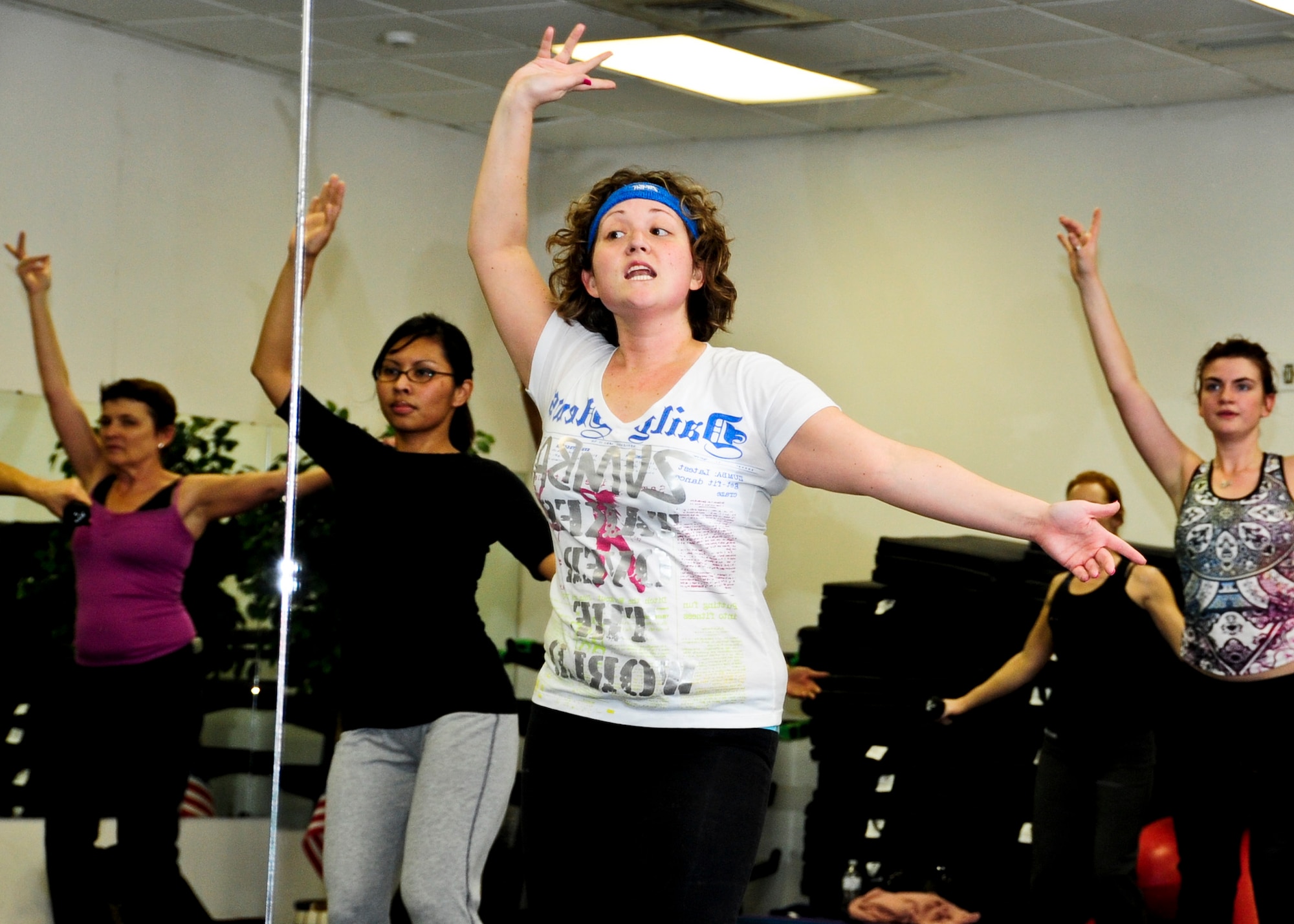 Iliana Tusseyskaggs leads her Zumba class Jan. 10 at the women’s field house. Zumba is a fitness program that blends international music to various dance moves. Zumba is offered at the women’s field house Mondays and Fridays from 4:30-5:30 p.m. For more information, call the fitness annex at 883-2129. (U.S. Air Force photo/Sachel Seabrook)