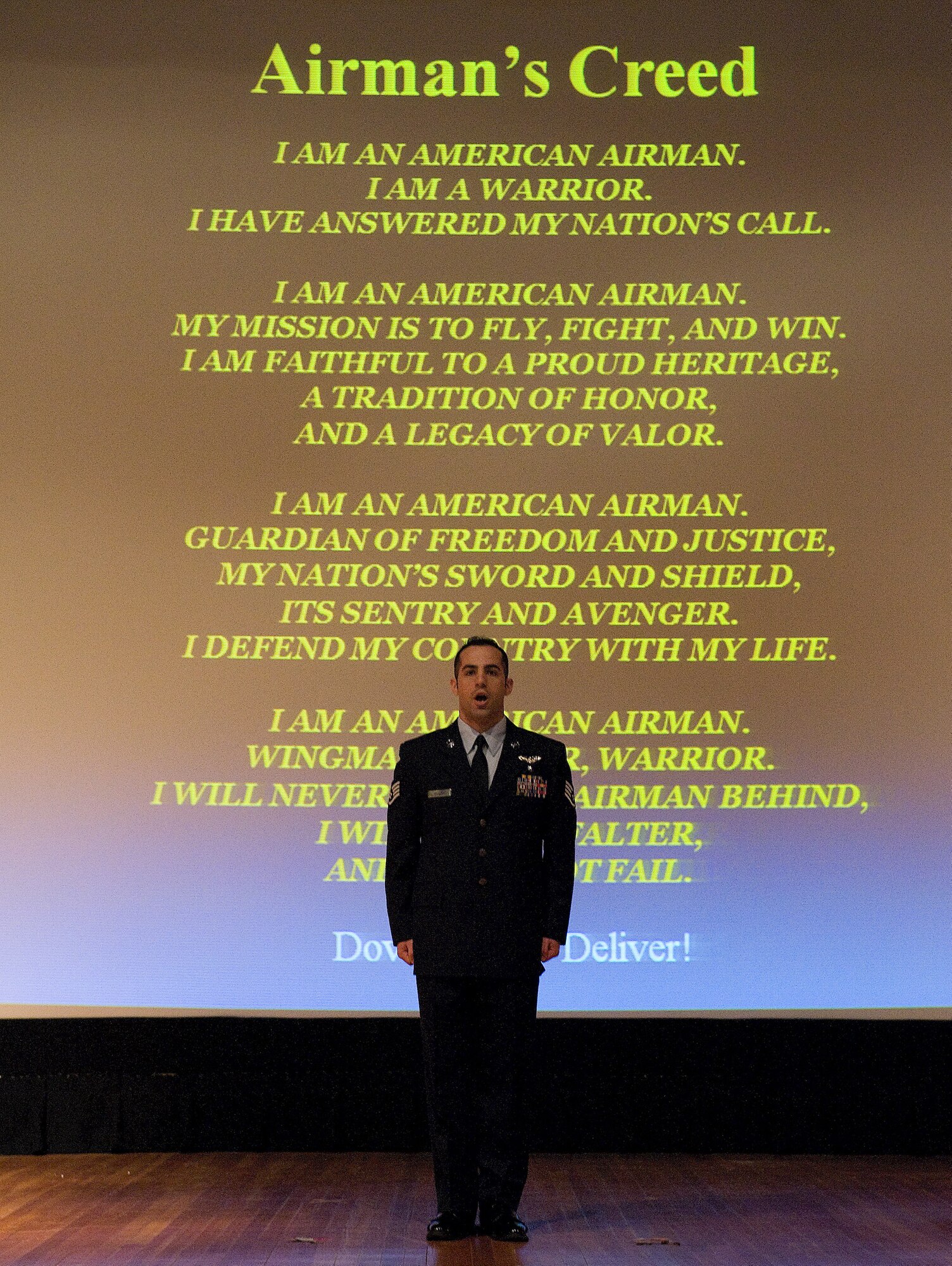 Staff Sgt. Kevin Siclari recites the Airmen's Creed to close the Dover Air Force Base, Del., Wing Quarterly Awards Jan. 6, 2011. Team Dover Airmen and civilians are selected for the awards based on their skills and past achievements. (U.S. Air Force photo by Jason Minto/Released)