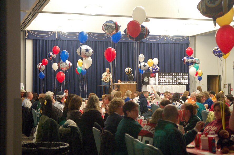 Frank Russo, 436th Force Support Squadron Community Activity Center director, gears up the crowd for a night of fun as he opens the Big Game Bingo event at The Landings Club Jan. 8, 2011.  The event was composed of several games of Bingo over the course of the night with a grand prize of $5,000. The Grand Prize pot was split three ways by Gerrie Krattinger, Tech. Sgt. Mike Passero and Kerry Lloyd.