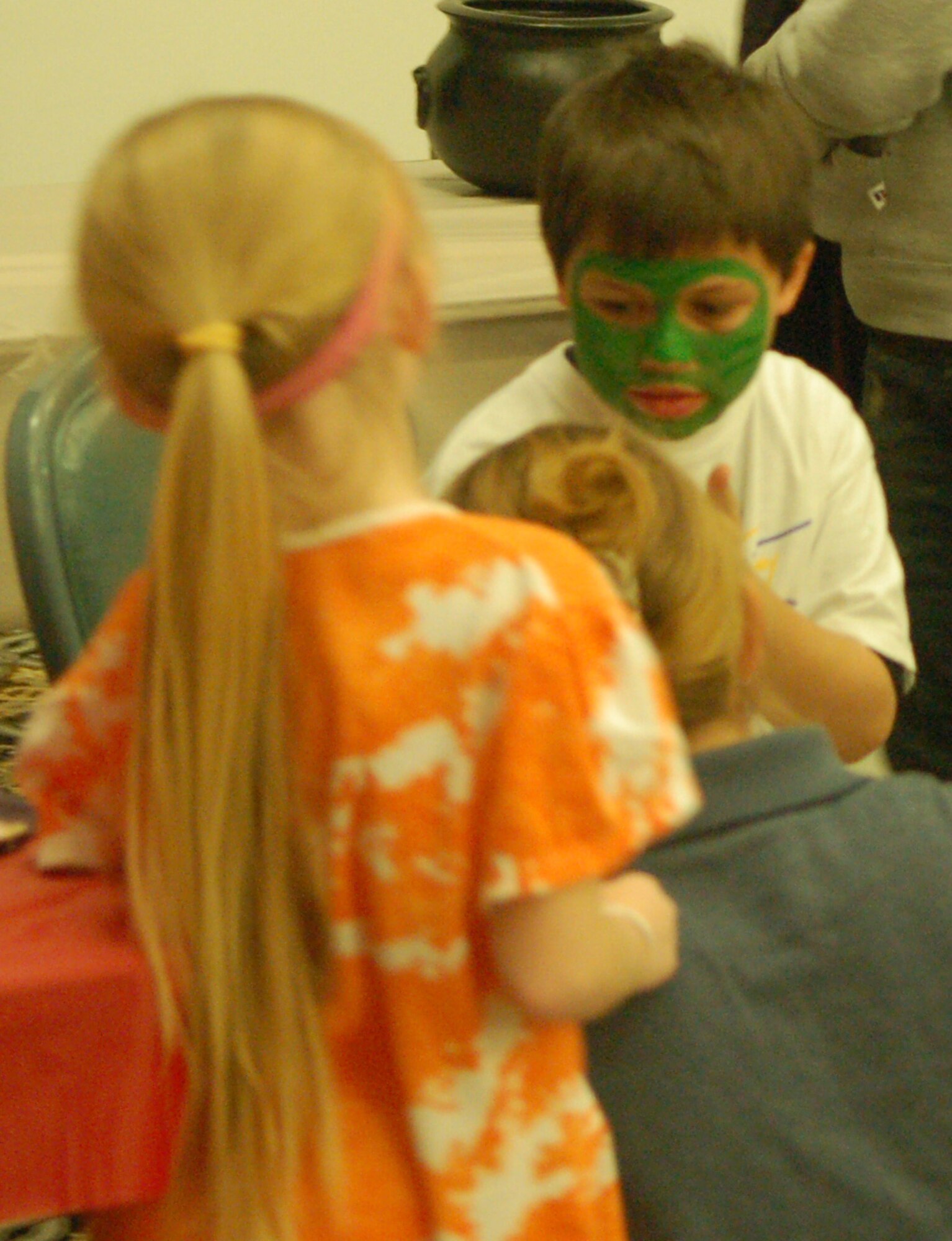 Children of Team Dover members get their faces painted during the Frosty Family Night hosted by The Landings Club Jan. 7, 2011. It was the first of many family nights for the New Year. The event hosted activities such as a bouncy castle, face painting, craft tables and movies for the children.   (U.S. Air Force photo by Airman 1st Class Matthew Hubby/Released)