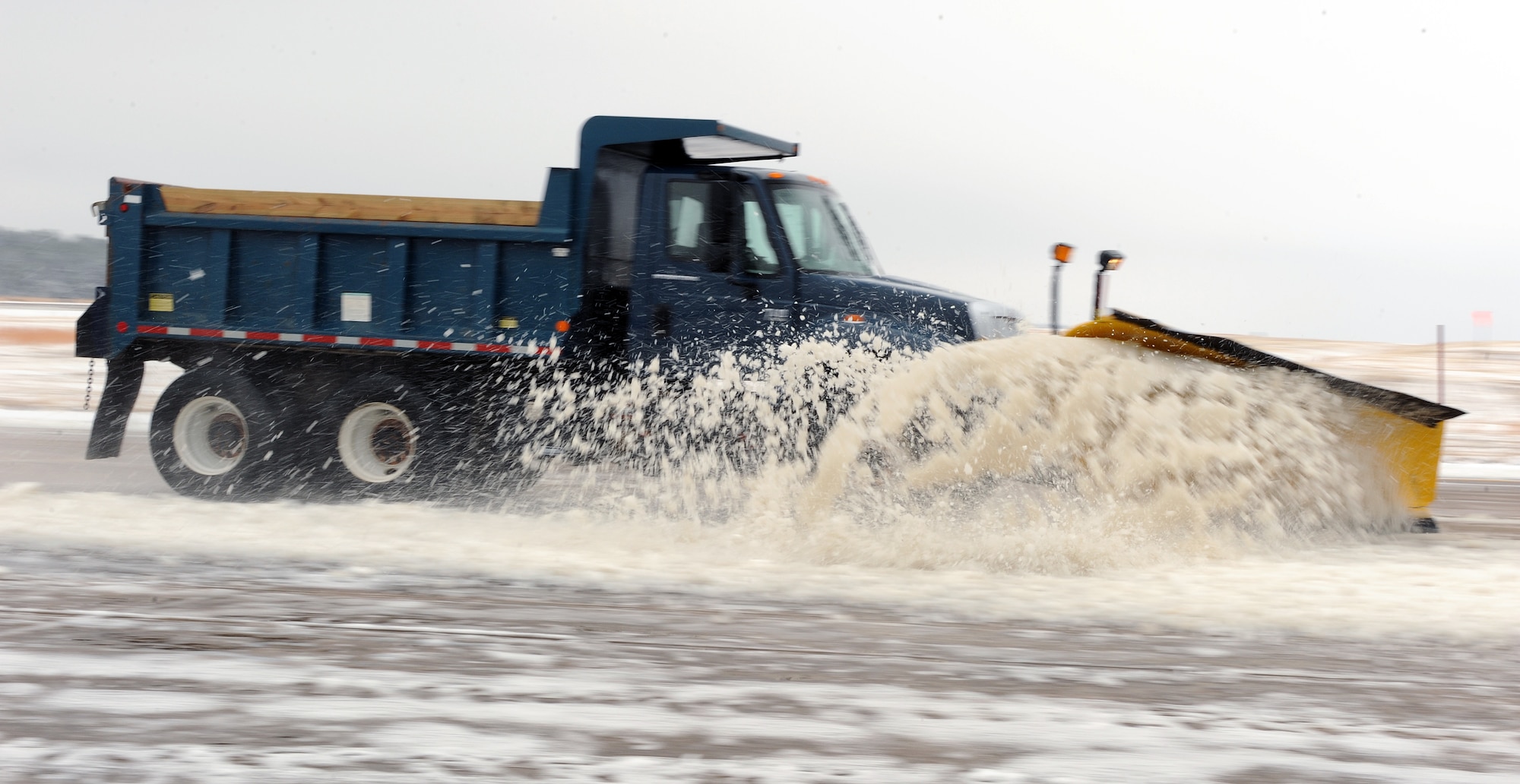 Tech. Sgt. James Masterson, 19th Civil Engineer Squadron heavy equipment operator, plows the flightline Jan. 10, 2011, at Little Rock Air Force Base, Ark. Team Little Rock's heavy equipment operators cleared off the flightline ensuring C-130 sorites flew that afternoon. (Air Force photo by Airman 1st Class Ellora Stewart)
