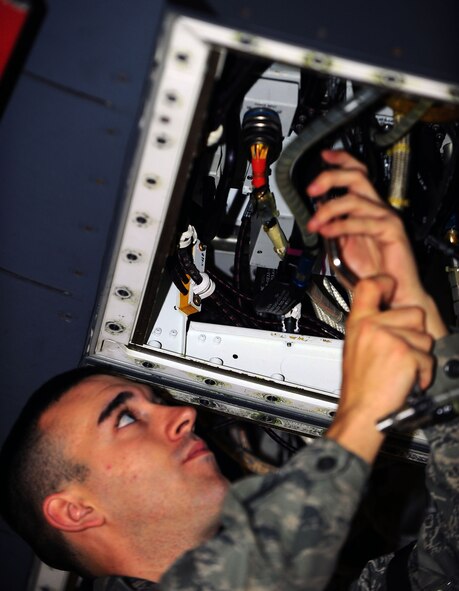 DYESS AIR FORCE BASE, Texas—Airman First Class Rick Cole, 7th Aircraft Maintenance Unit, measures a radio frequency transmit signal Jan. 10 on a B-1 Bomber in the three bay hanger here. From Pittsburgh, Airman Cole has spent 10 months at Keesler and Sheppard Air Force Base for training, and has been at Dyess three months. Airman Cole is one of approximately 30 electronic warfare specialists stationed here. (Air Force photo/ Airman First Class Courtney Moses)