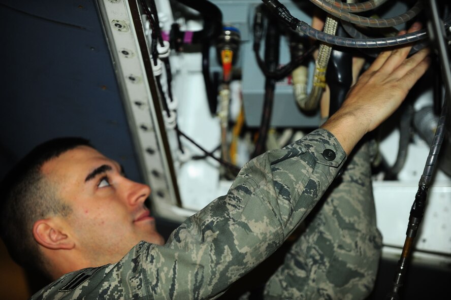 DYESS AIR FORCE BASE, Texas—Airman First Class Rick Cole, 7th Aircraft Maintenance Unit, measures a radio frequency transmit signal Jan. 10 on a B-1 Bomber in the three bay hanger here. From Pittsburgh, Airman Cole has spent 10 months at Keesler and Sheppard Air Force Base for training, and has been at Dyess three months. Airman Cole is one of approximately 30 electronic warfare specialists stationed here. (Air Force photo/ Airman First Class Courtney Moses)