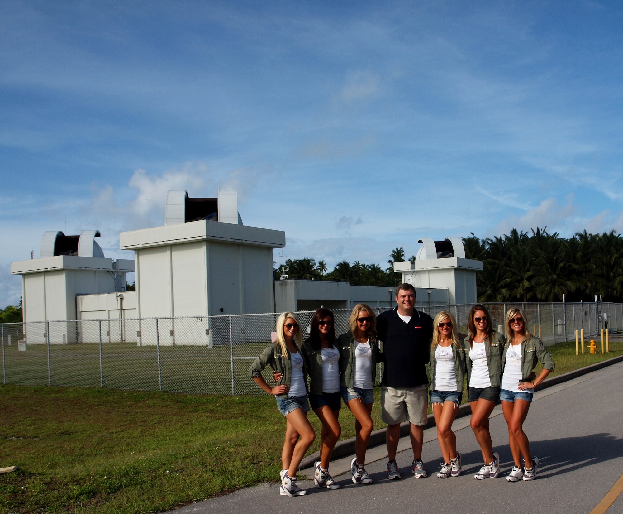 DIEGO GARCIA, Indian Ocean — Site contractor Mike Runkle (center) gives the Minnesota Vikings cheerleaders an educational orientation of the 21st Operations Group Detachment 2 site at Diego Garcia Jan. 2. The cheerleaders learned about the Det. 2 Ground-based Electro Optical Deep Space Surveillance mission to detect, track and identify space objects. Det. 2, located in the Indian Ocean, is one of the 21st Space Wing’s geographically separated units conducting precise and disciplined missile warning, missile defense and space control operations. The trip was sponsored by the Morale, Welfare and Recreation and sends entertainers around the globe to support deployed servicemembers overseas. (U.S. Air Force photo/Bruce Chatfield)