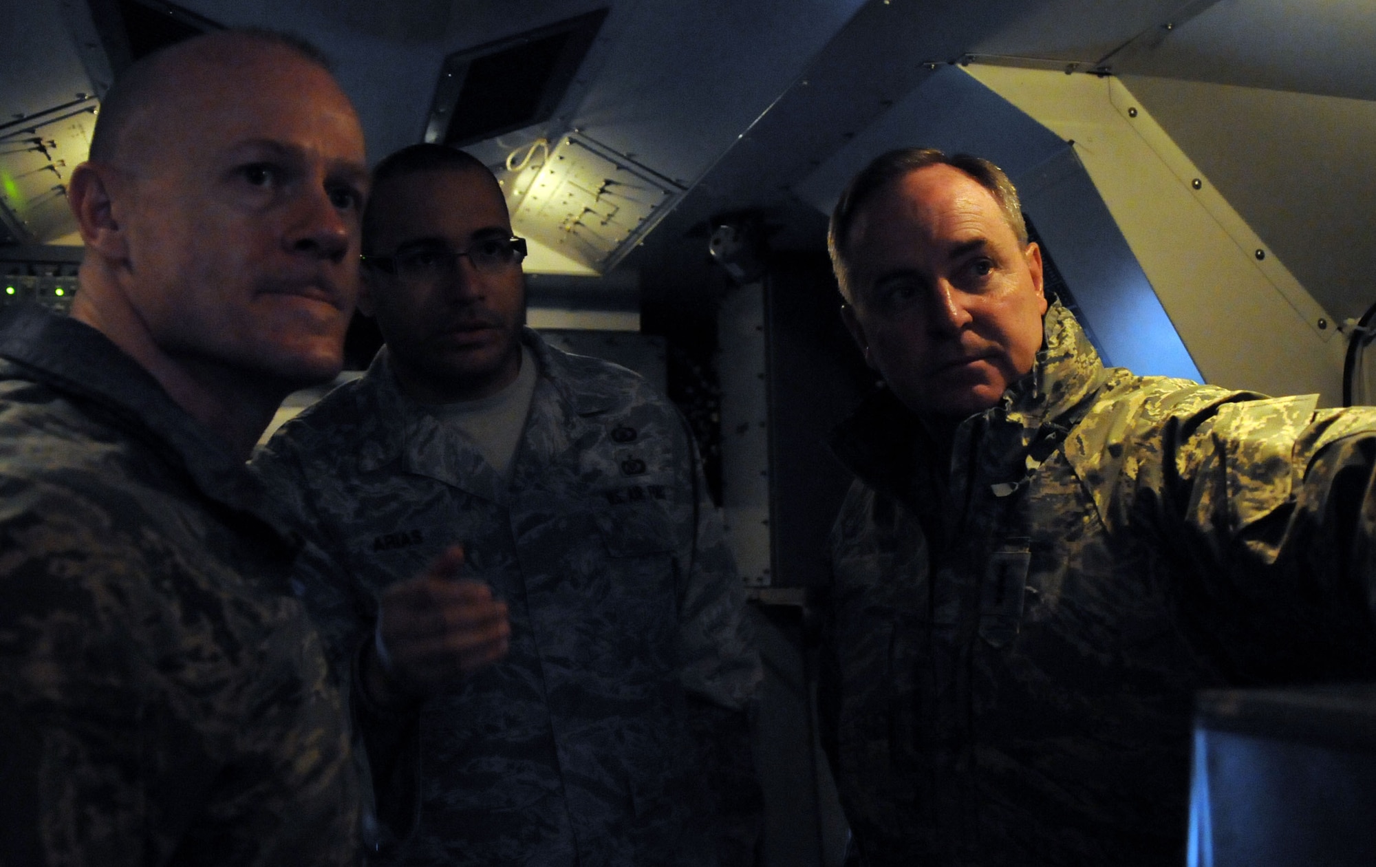Gen. Mark A. Welsh III, U.S. Air Forces in Europe commander, and Chief Master Sgt. David Williamson, USAFE command chief, receive an orientation from Staff Sgt. Johnny Arias, 603rd Air Control Squadron weapons  director, during their visit to Aviano Air Base, Italy, Jan. 10-11. This was General Welsh's first official visit to a USAFE wing since his assumption of command. (U.S. Air Force photo/ Staff Sgt. Nadine Y. Barclay)